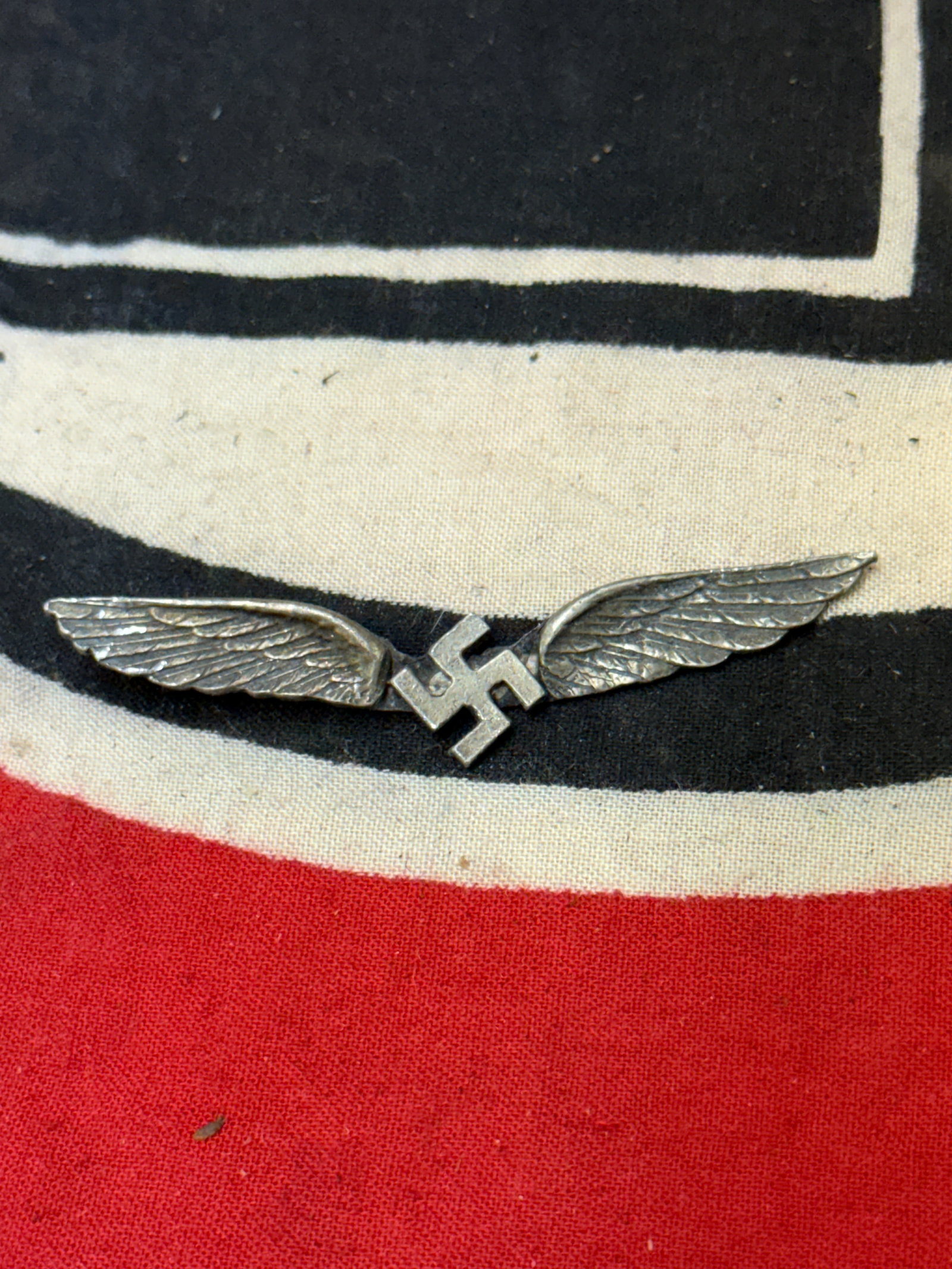 WW2 GERMAN CIVILIAN AVIATION SILVER BADGE: WW2 GERMAN CIVILIAN AVIATION SILVER BADGE. A VERY RARE EXAMPLE THAT IS IN MINT OVERALL SHAPE AND CONDITION WITH A BEAUTIFUL OVERALL PATINA. AN ULTRA RARE FIND. SHOWS GOOD WEAR AND USE WITH A BEAUTIFUL
