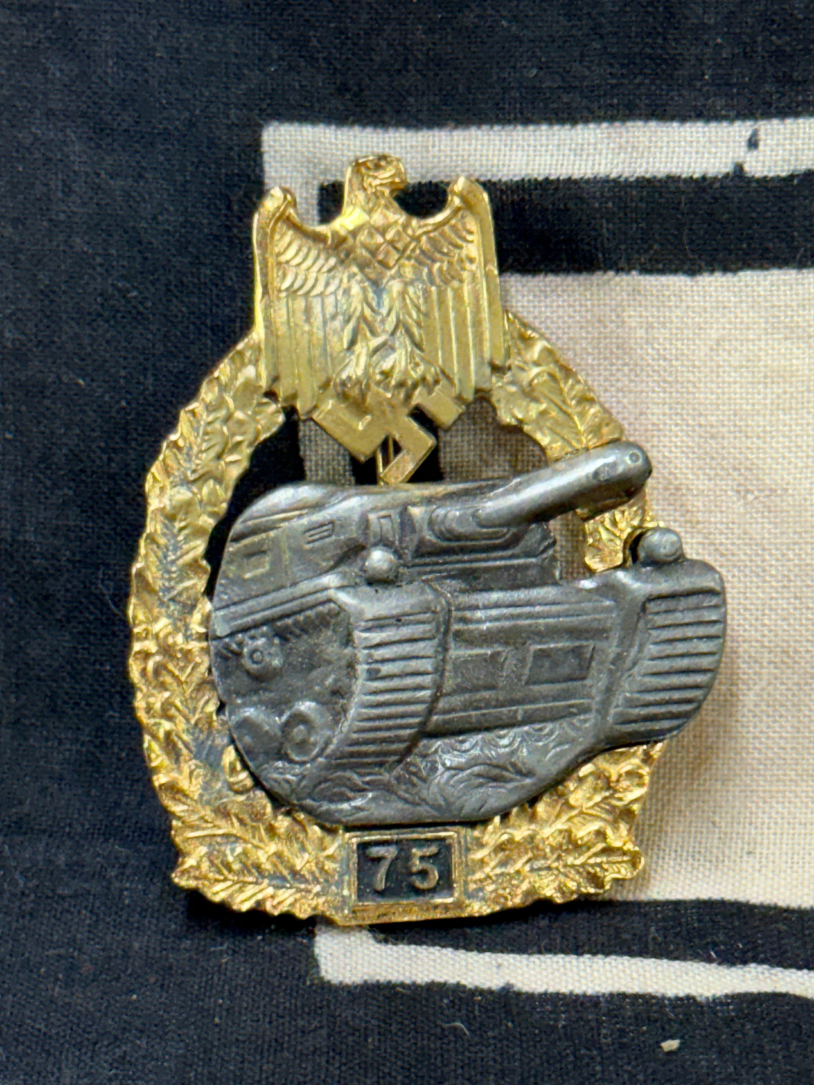 WW2 German Panzer Tank battle badge - 75 Actions Gold and Silver: WW2 German Panzer Tank battle badge - 75 Actions Gold and Silver. A very rare example that is in mint overall shape and condition with a beautiful overall patina. Shows good wear and use with a beauti