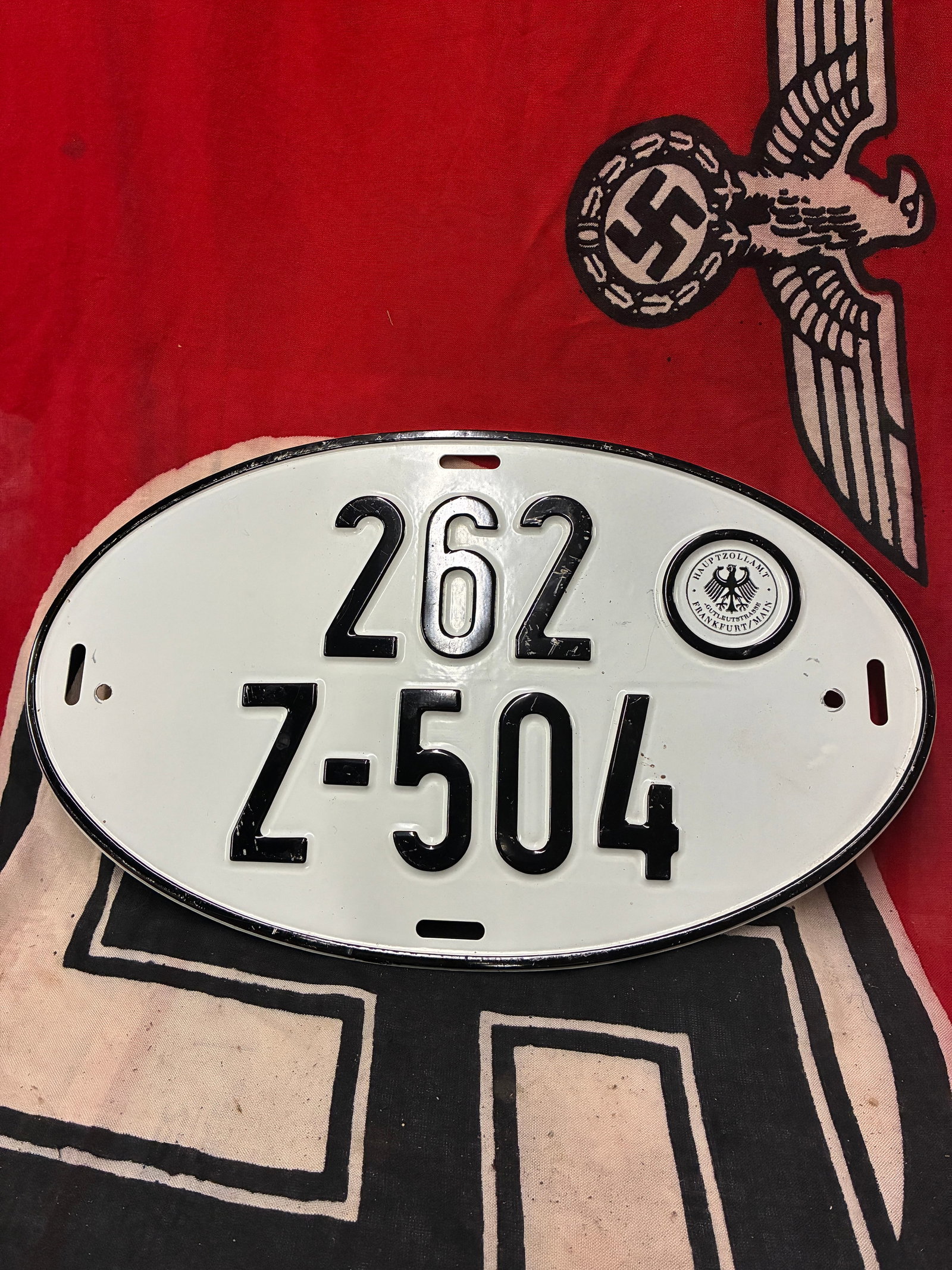 SCARCE WW2 GERMAN HAUPTZOLLAM.T LICENSE PLATE: SCARCE WW2 GERMAN HAUPTZOLLAM.T LICENSE PLATE. A RARE FIND. SHOWS GOOD WEAR AND USE WITH A BEAUTIFUL OVERALL PATINA. PLEASE VIEW ALL DETAILED PICTURES. A VERY RARE EXAMPLE OF THE TIME PERIOD.