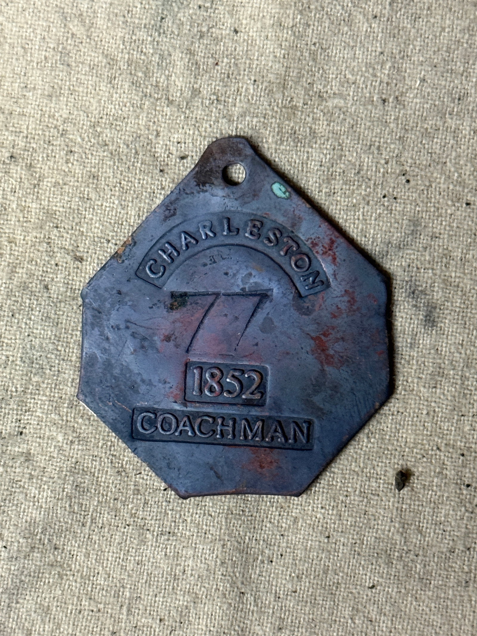 DATED 1852 CHARLESTON #77 COACHMAN SLAVE TAG SERVANT ID: DATED 1852 CHARLESTON #77 COACHMAN SLAVE TAG SERVANT ID. A RARE EXAMPLE. IT IS IN MINT OVERALL SHAPE AND CONDITION WITH A BEAUTIFUL OVERALL PATINA. HAS A GREAT LOOK TO IT WITH AN EXCELLENT OVERALL EYE