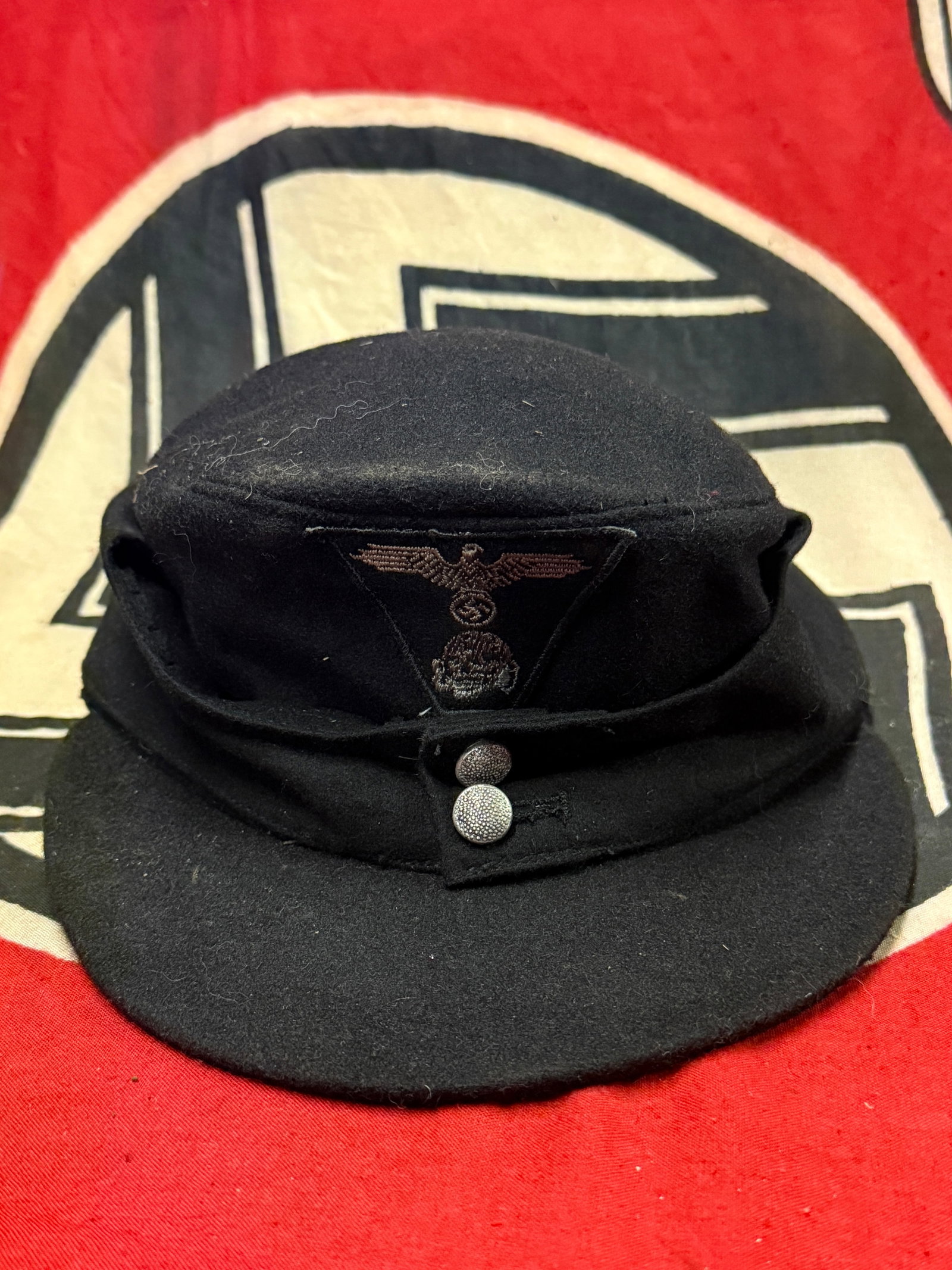 German WWII Waffen-SS Panzer Black M43 Field Cap Marked SS-BW: German WWII Waffen-SS Panzer Black M43 Field Cap Marked SS-BW. The SS (Schutzstaffel - 'Protection Squadron') was originally formed in 1925, ostensibly to act as a small, loyal bodyguard unit to prote