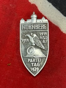 WWII GERMAN NURNBERG PARTY BADGE.