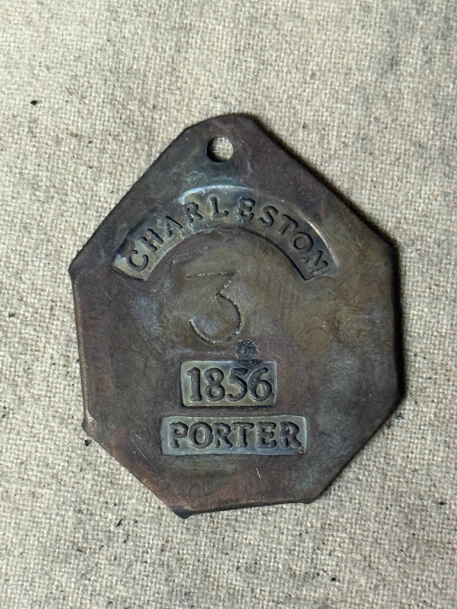 DATED 1856 CHARLESTON #3 PORTER SLAVE TAG SERVANT ID: DATED 1856 CHARLESTON #3 PORTER SLAVE TAG SERVANT ID. A RARE FIND. SHOWS GOOD WEAR AND USE WITH A BEAUTIFUL OVERALL PATINA. PLEASE VIEW ALL DETAILED PICTURES. A SCARCE EXAMPLE OF THE TIME PERIOD.