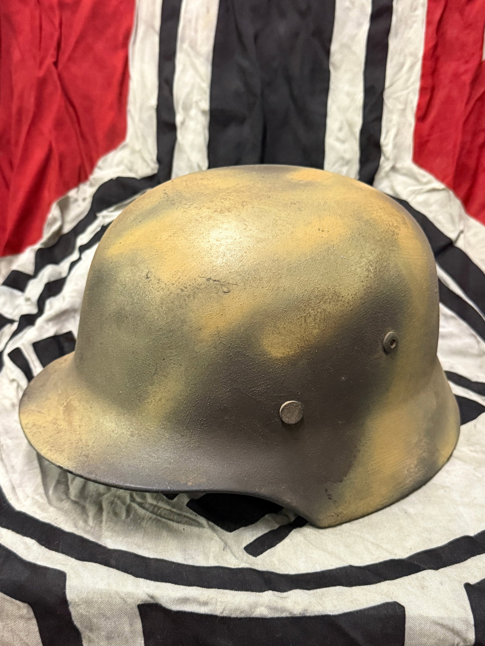 SCARCE WW2 GERMAN M40 NORMANDY CAMO HELMET: SCARCE WW2 GERMAN M40 NORMANDY CAMO HELMET. AN ULTRA RARE FIND THAT IS IN MINT OVERALL SHAPE AND CONDITION WITH A BEAUTIFUL OVERALL PATINA. BEAUTIFUL FADED CAMO PAINT FROM YEARS OF USE AND WEAR. MAKER