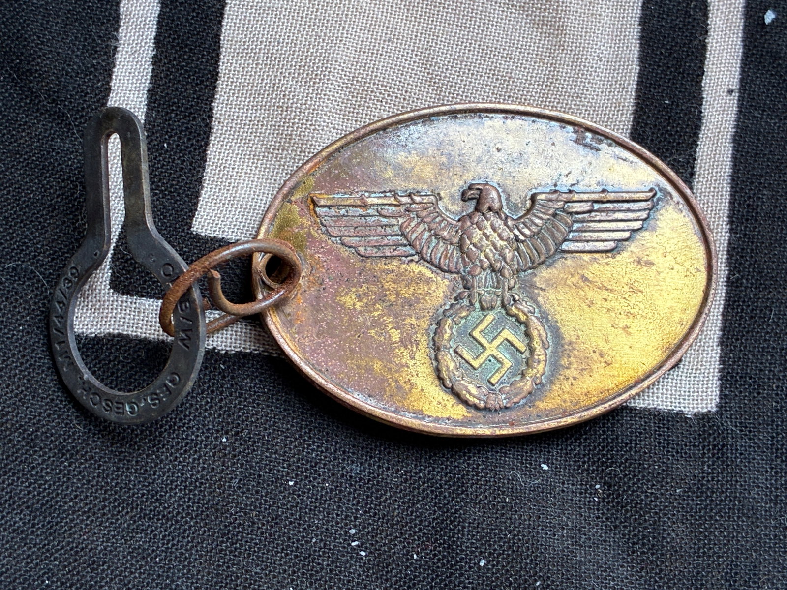 WW2 German SS. A Rare Staatliche Kriminalpolizei Warrant Disc #240: WW2 German SS. A Rare Staatliche Kriminalpolizei Warrant Disc #240. (Kripo Dienstmarke). Constructed of bronze, the obverse bearing a raised German national eagle clutching a wreathed mobile swastika,