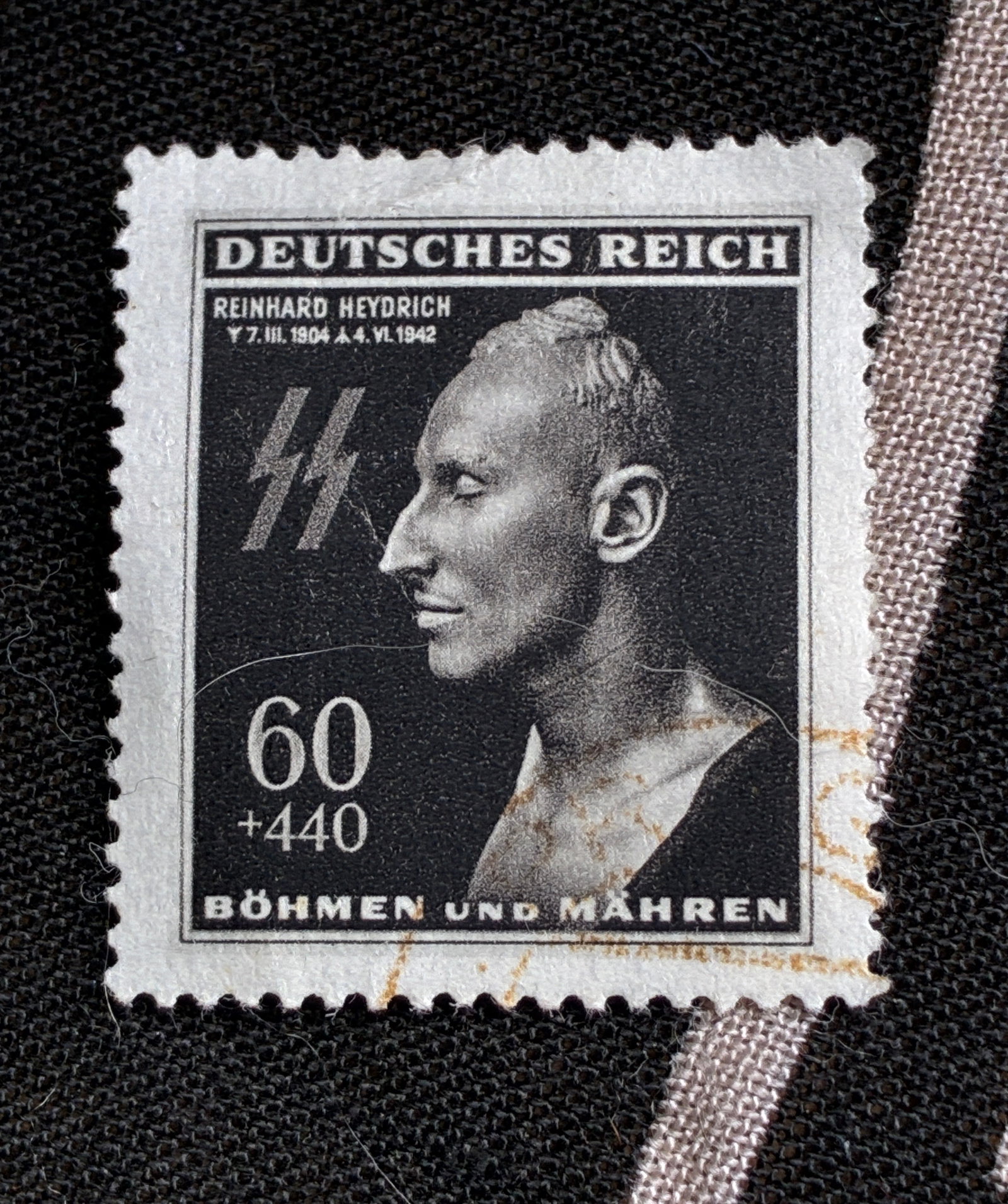 WW2 German EBS Bohemia & Moravia 1943 - Reinhard Heydrich Death Mask - Michel 131 Stamp: WW2 German EBS Bohemia & Moravia 1943 - Reinhard Heydrich Death Mask - Michel 131 Stamp. A very rare example that is in mint overall shape and condition with a beautiful overall patina. Please view al