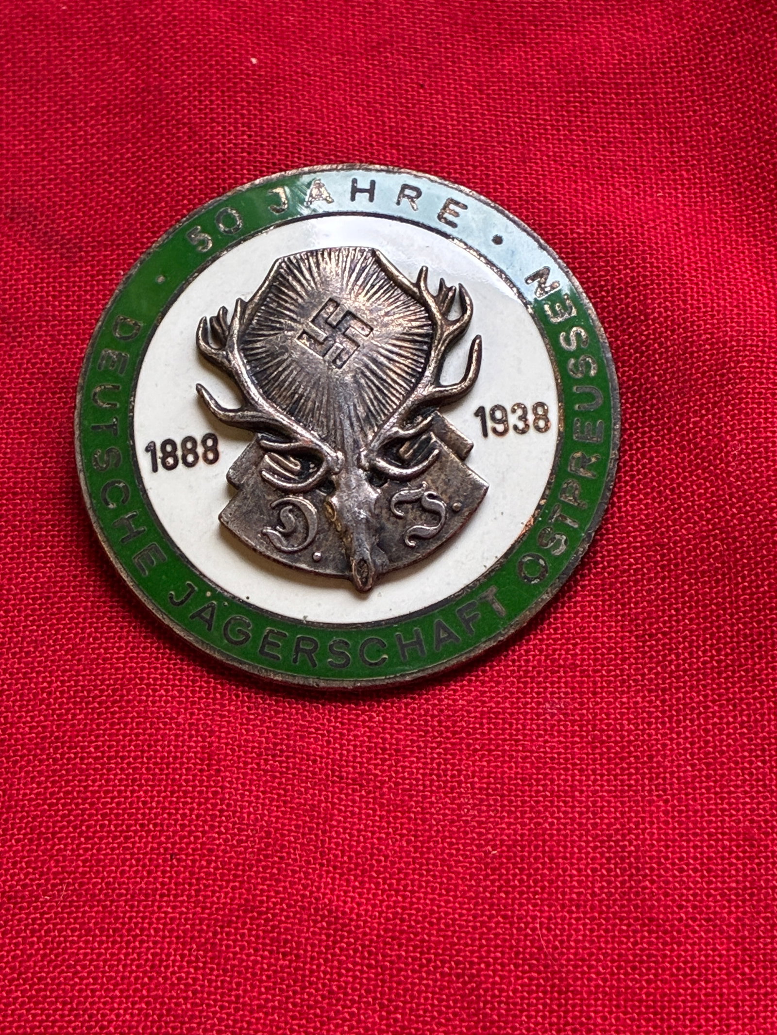 Rare WW2 German Badge Commemorating 50 Years of the Deutsche Jagerschaft (German Hunting Society) In: Rare WW2 German Badge Commemorating 50 Years of the Deutsche Jagerschaft (German Hunting Society) In East Prussia. Has a maker mark on the back. Shows good wear and use with a beautiful overall patina