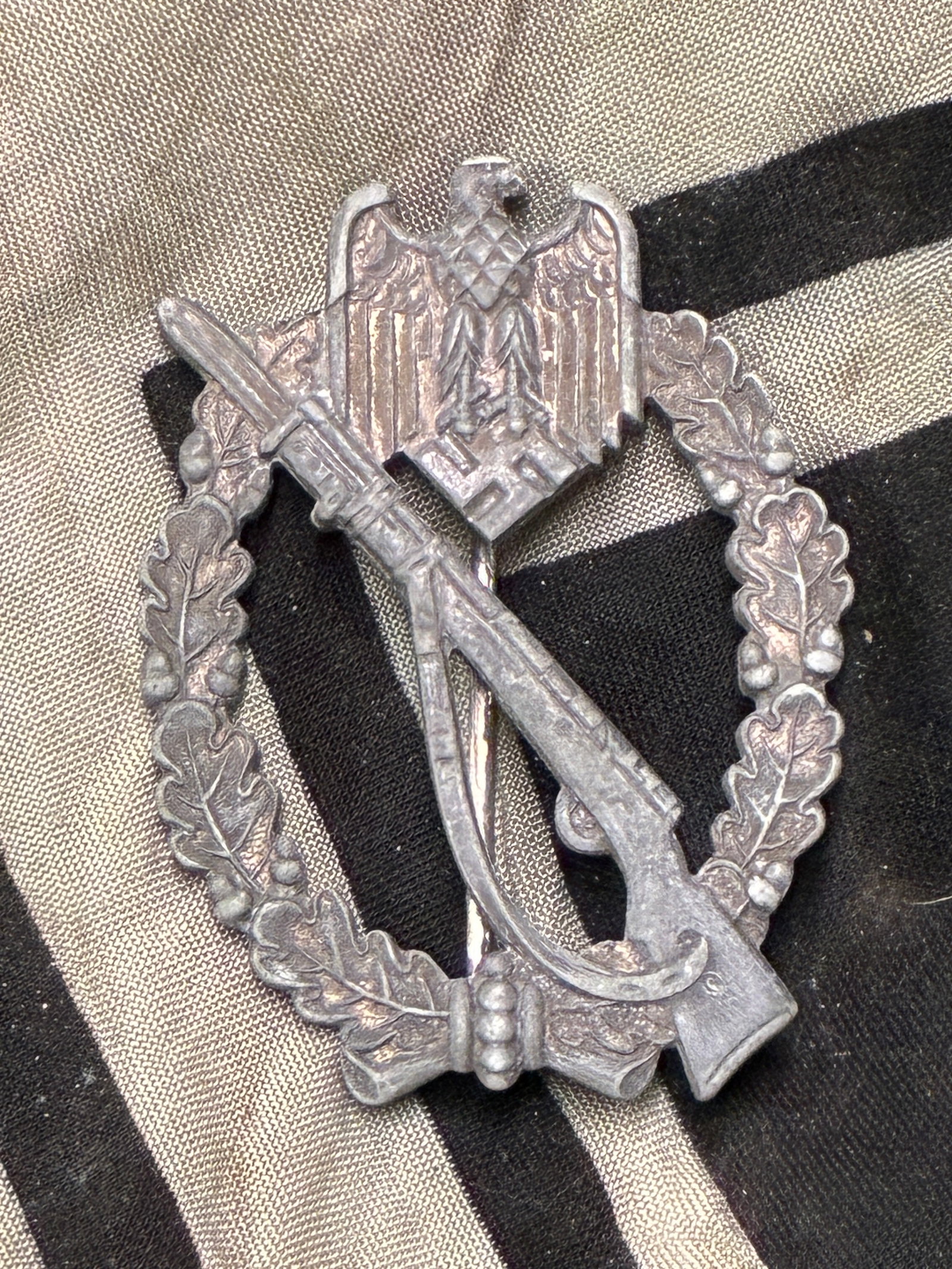 WWII German Infantry Assault Badge In Silver: WWII German Infantry Assault Badge In Silver. The Infantry Assault Badge in silver was introduced on December 20TH 1939 by Generaloberst Walther von Brauchitsch, for award to Officers, and EM/NCO’s 