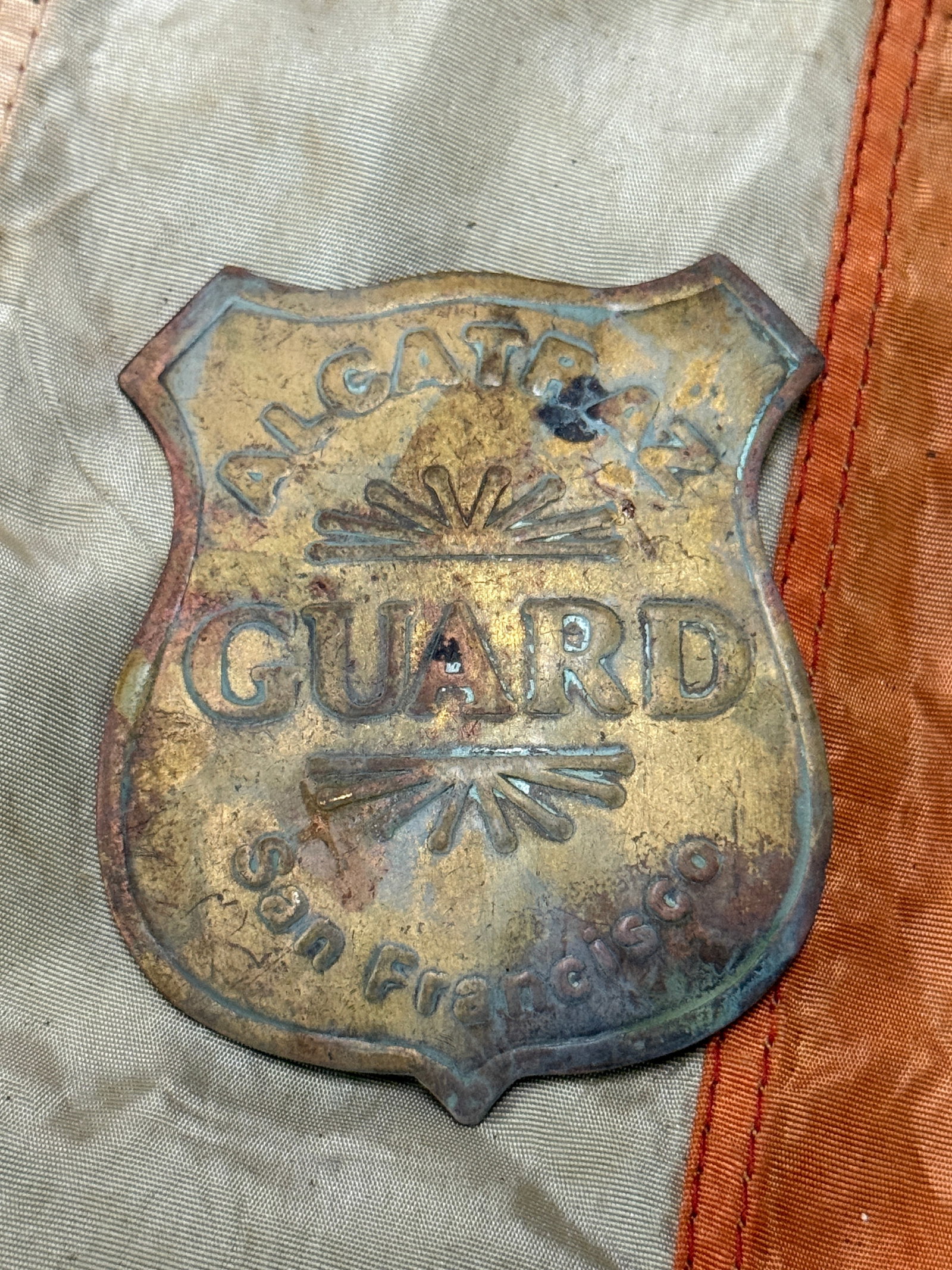 LATE 1930'S ALCATRAZ PRISON SAN FRANCISCO GUARD BADGE: LATE 1930'S ALCATRAZ PRISON SAN FRANCISCO GUARD BADGE. A RARE EXAMPLE THAT IS IN MINT OVERALL SHAPE AND CONDITION WITH A BEAUTIFUL OVERALL PATINA. HAS A GREAT LOOK TO IT WITH A N EXCELLENT OVERALL EYE