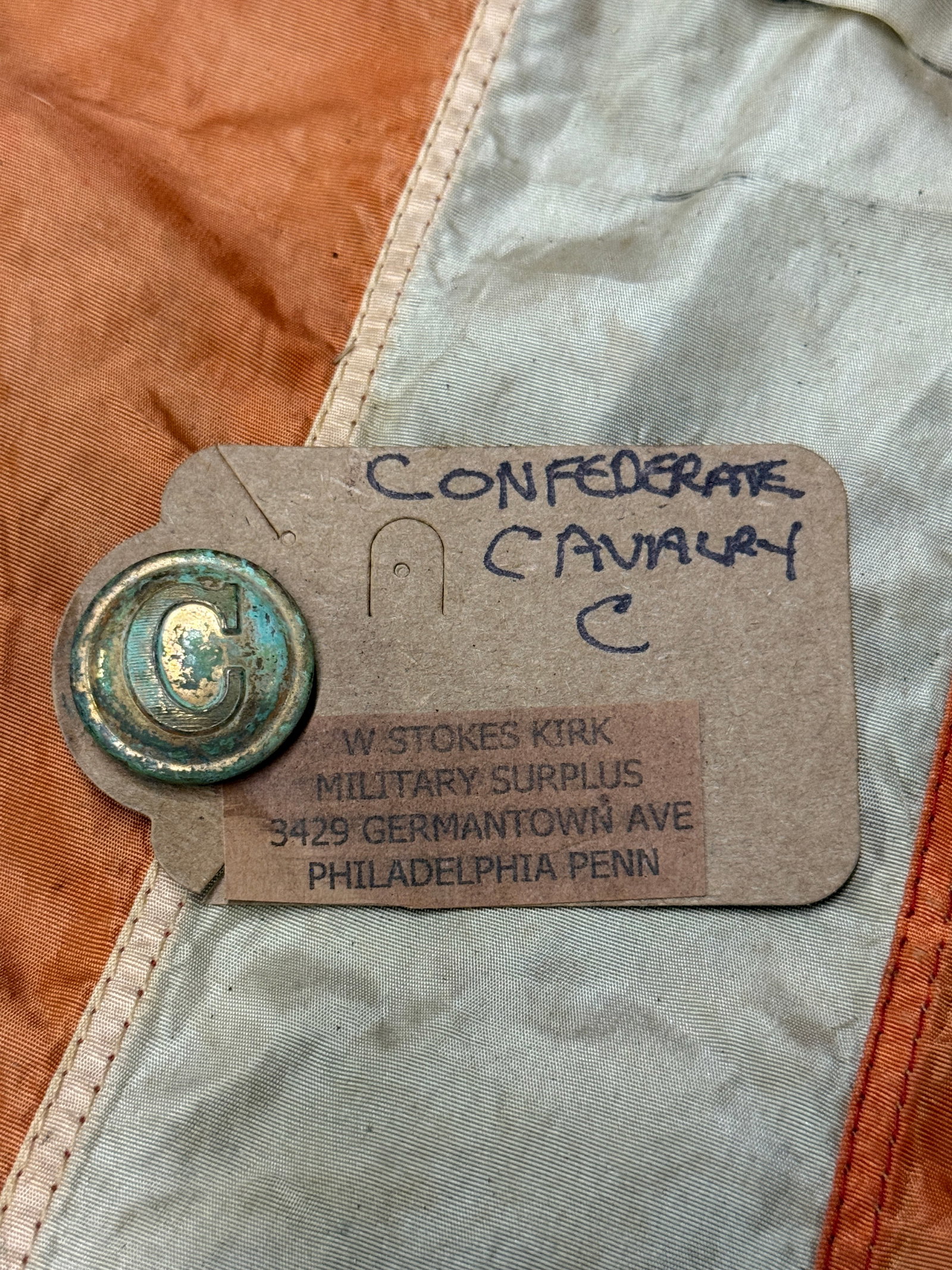 CIVIL WAR CONFEDERATE CAVALRY "C" BUTTON BY W. STOKES KIRK: CIVIL WAR CONFEDERATE CAVALRY "C" BUTTON BY W. STOKES KIRK. A RARE EXAMPLE THAT IS IN MINT OVERALL SHAPE AND CONDITION WITH A BEAUTIFUL OVERALL PATINA. COMES WITH THE ORIGINAL MAKER TAG. PLEASE VIEW A