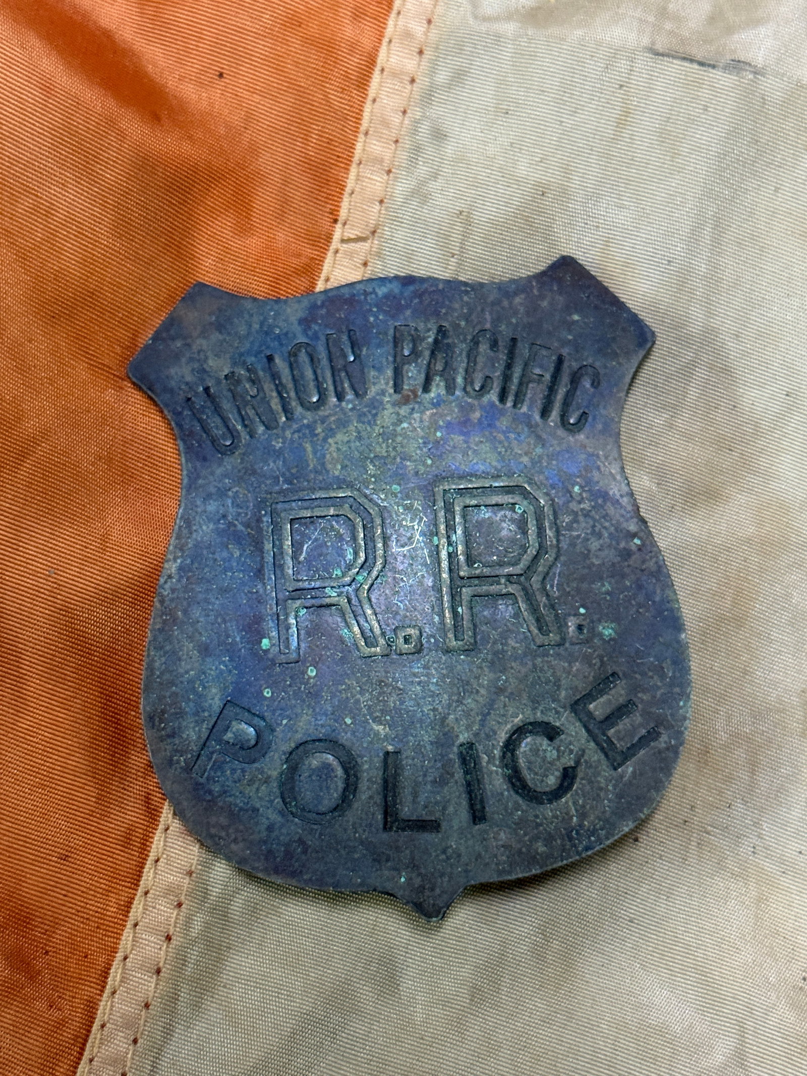 1800'S UNION PACIFIC RAILROAD POLICE BADGE: 1800'S UNION PACIFIC RAILROAD POLICE BADGE. A RARE EXAMPLE THAT IS IN MINT OVERALL SHAPE AND CONDITION WITH A BEAUTIFUL OVERALL PATINA. HAS A GREAT LOOK TO IT WITH A N EXCELLENT OVERALL EYE APPEAL. PL