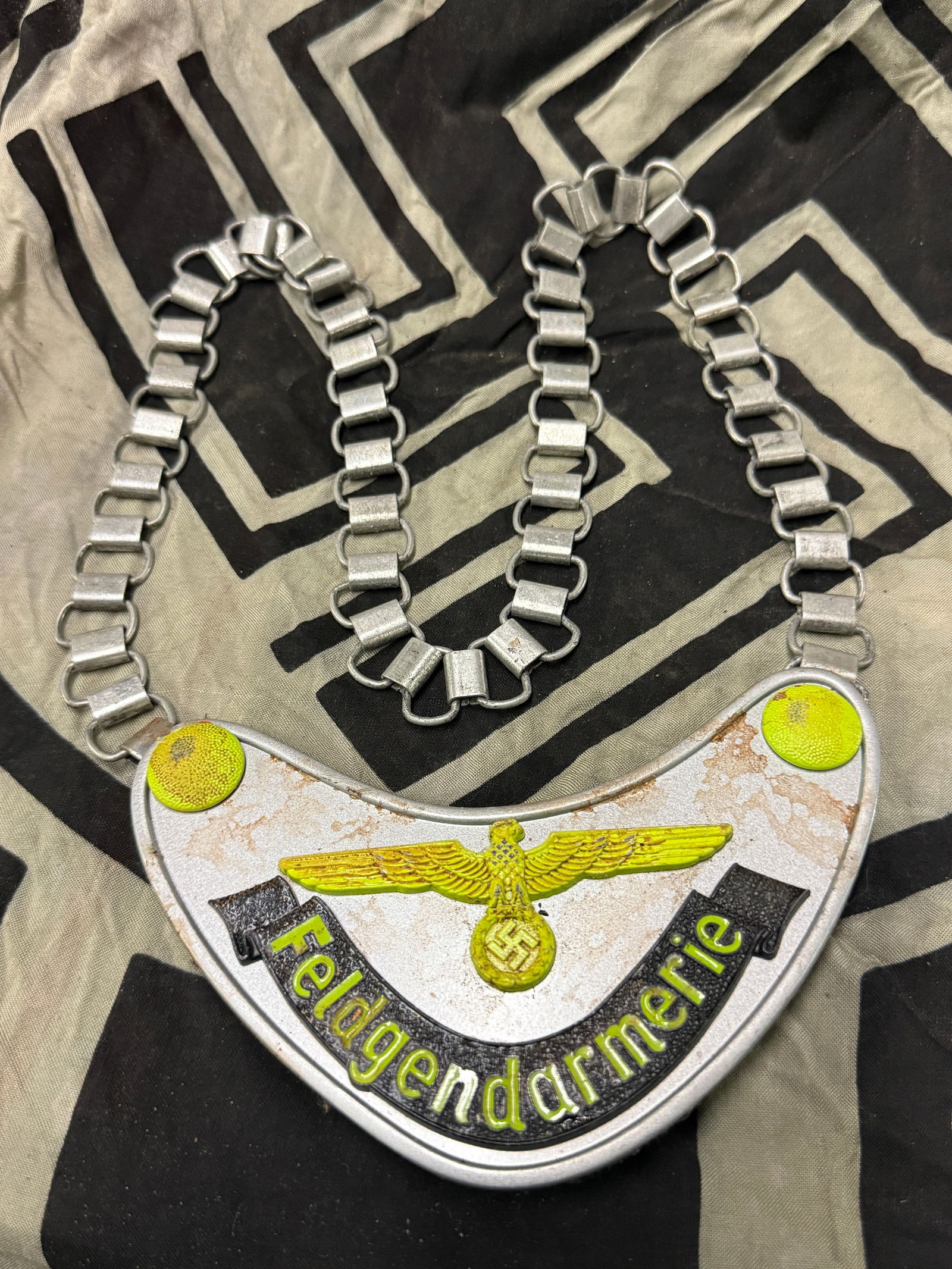 WW2 German Wehrmacht “Feldgendarmerie?? Gorget: WW2 German Wehrmacht “Feldgendarmerie” Gorget. Wehrmacht Ringkragen “Feldgendarmerie” (Army Military Field Police). Multi-piece construction, both the gorget and the chain are made ent