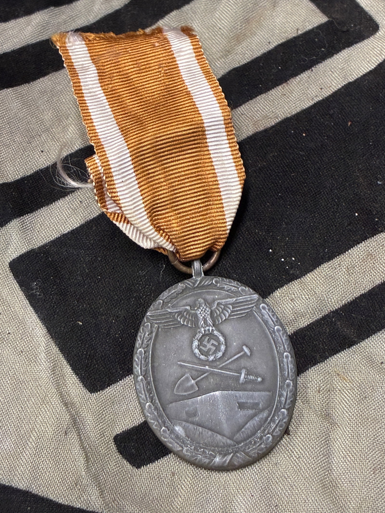 WWII German West Wall Medal (Deutsches Schutzwall-Ehrenzeichen): WWII German West Wall Medal (Deutsches Schutzwall-Ehrenzeichen). The West Wall Medal was instituted by Adolf Hitler on August 2nd 1939 to recognize military personnel, including civilian employees, wh