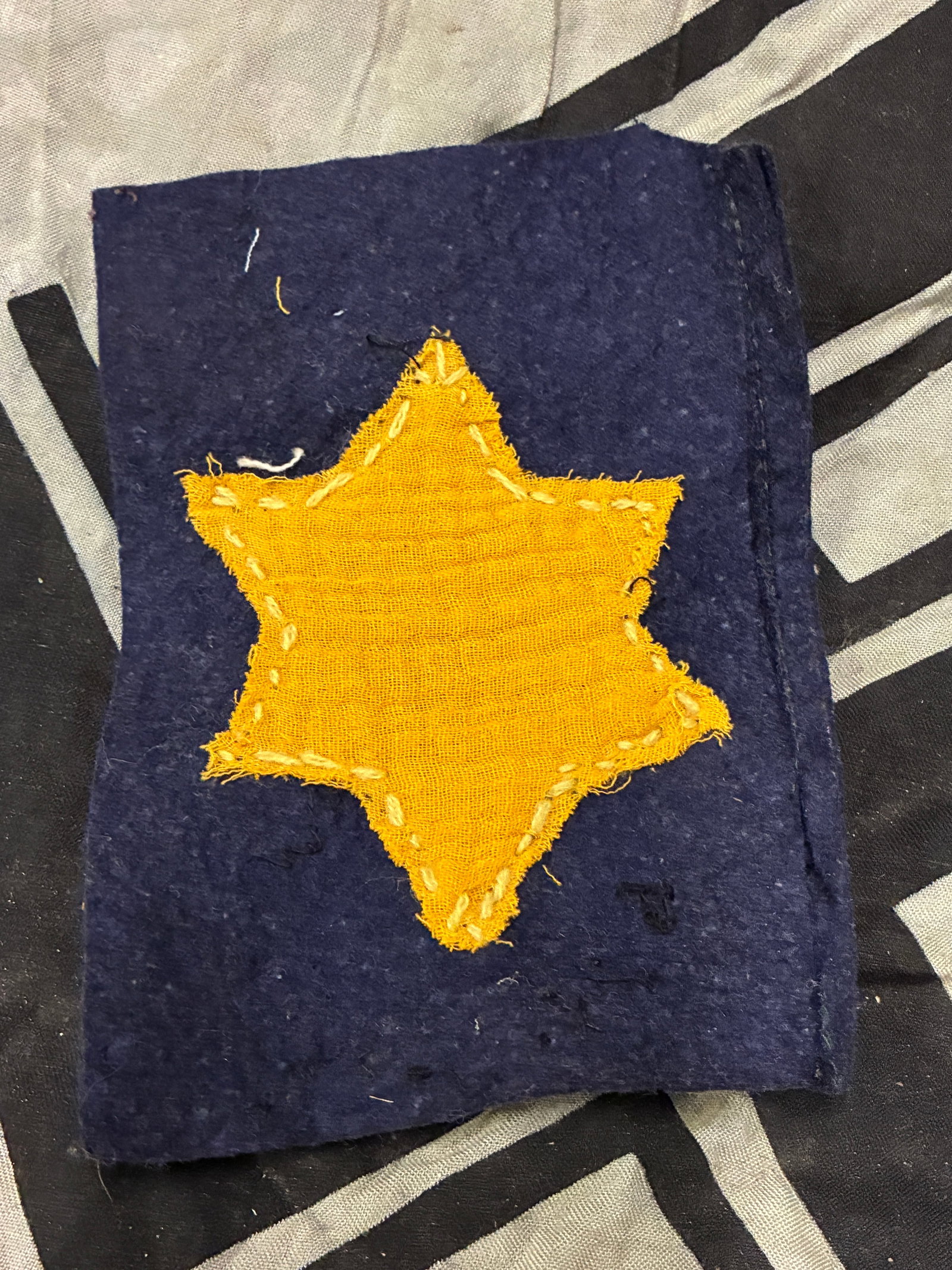 UNIFORM CUT OFF WW2 GERMAN STAR OF DAVID BADGE: UNIFORM CUT OFF WW2 GERMAN STAR OF DAVID BADGE. A very rare example that is in mint overall shape and condition with a beautiful overall patina. Please view all detailed pictures. A very rare example 