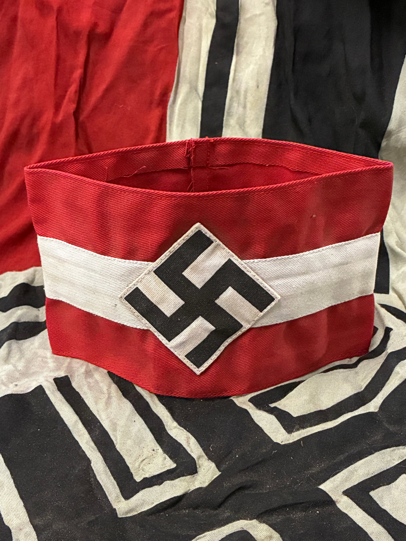 WW2 GERMAN MULTI-PIECE CONSTRUCTION HITLER YOUTH HJ ARMBAND WITH RZM PAPER TAG: WW2 GERMAN MULTI-PIECE CONSTRUCTION HITLER YOUTH HJ ARMBAND WITH RZM PAPER TAG. A RARE FIND. SHOWS GOOD WEAR AND USE WITH A BEAUTIFUL OVERALL PATINA. PLEASE VIEW ALL DETAILED PICTURES. A SCARCE EXAMPL
