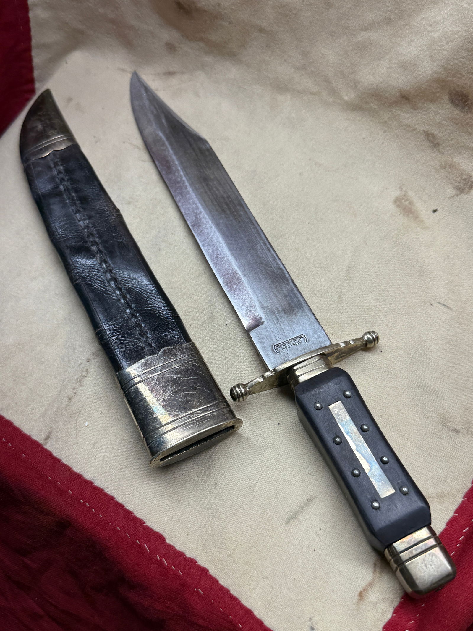EBONY WOOD HANDLE CIVIL WAR LARGE BOWIE KNIFE BY THOS. SHORT JR. SHEFFIELD: EBONY WOOD HANDLE CIVIL WAR LARGE BOWIE KNIFE BY THOS. SHORT JR. SHEFFIELD. COMES WITH THE ORIGINAL LEATHER SHEATH. THIS KNIFE HAS A GREAT LOOK TO IT WITH AN EXCELLENT OVERALL EYE APPEAL. VERY WELL MA