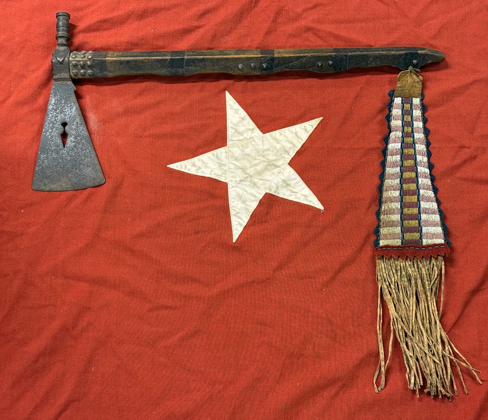 1800'S NATIVE AMERICAN NAVAJO INDIANS PIERCED DAGGER SMOKING PIPE TOMAHAWK WITH BEADED DROP: 1800'S NATIVE AMERICAN NAVAJO INDIANS PIERCED DAGGER SMOKING PIPE TOMAHAWK WITH BEADED DROP. THIS IS AN ULTRA RARE FIND THAT IS IN MINT USED SHAPE AND CONDITION WITH A BEAUTIFUL PATINA THROUGHOUT. HAS