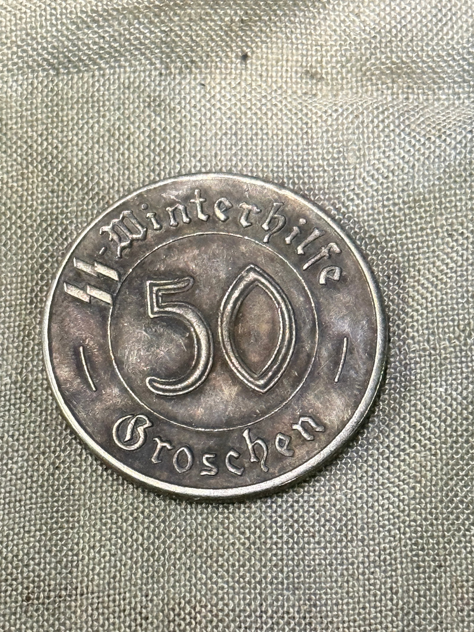 WW2 GERMAN TOTENKOPF SS 50 GORSCHEN SS WINTERHILFE SILVER COIN: WW2 GERMAN TOTENKOPF SS 50 GORSCHEN SS WINTERHILFE SILVER COIN. A RARE FIND. SHOWS GOOD WEAR AND USE WITH A BEAUTIFUL OVERALL PAITNA. PLEASE VIEW ALL DETAILED PICTURES. A RARE FIND.