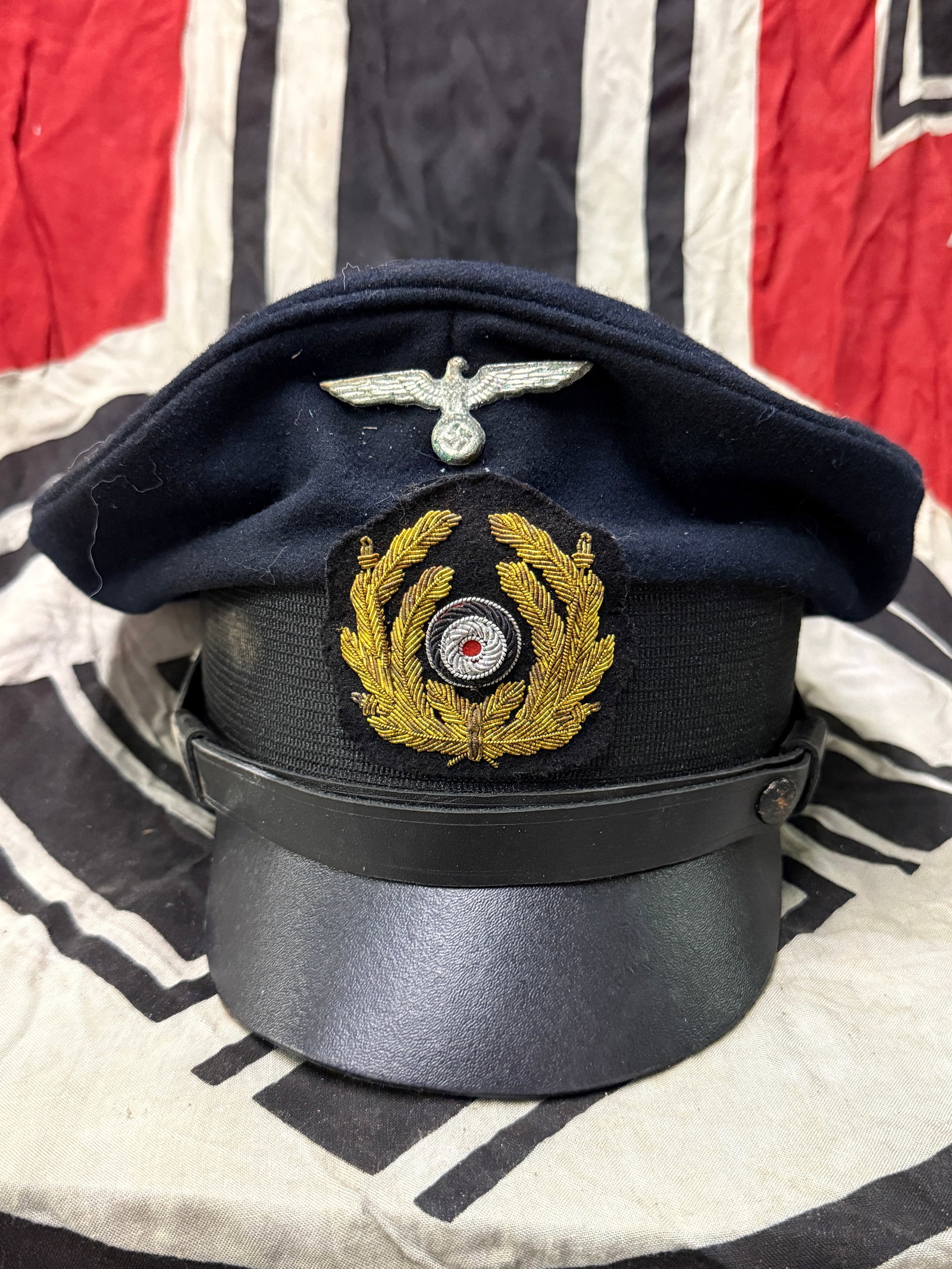 WW2 GERMAN KRIEGSMARINE OFFICERS VISOR CAP BY JOHANNES HERRMANN: WW2 GERMAN KRIEGSMARINE OFFICERS VISOR CAP BY JOHANNES HERRMANN. AN ULTRA RARE FIND THAT IS IN MINT OVERALL SHAPE AND CONDITION WITH A BEAUTIFUL OVERALL PATINA. SHOWS GOOD WEAR AND USE. MAKER MARKED O