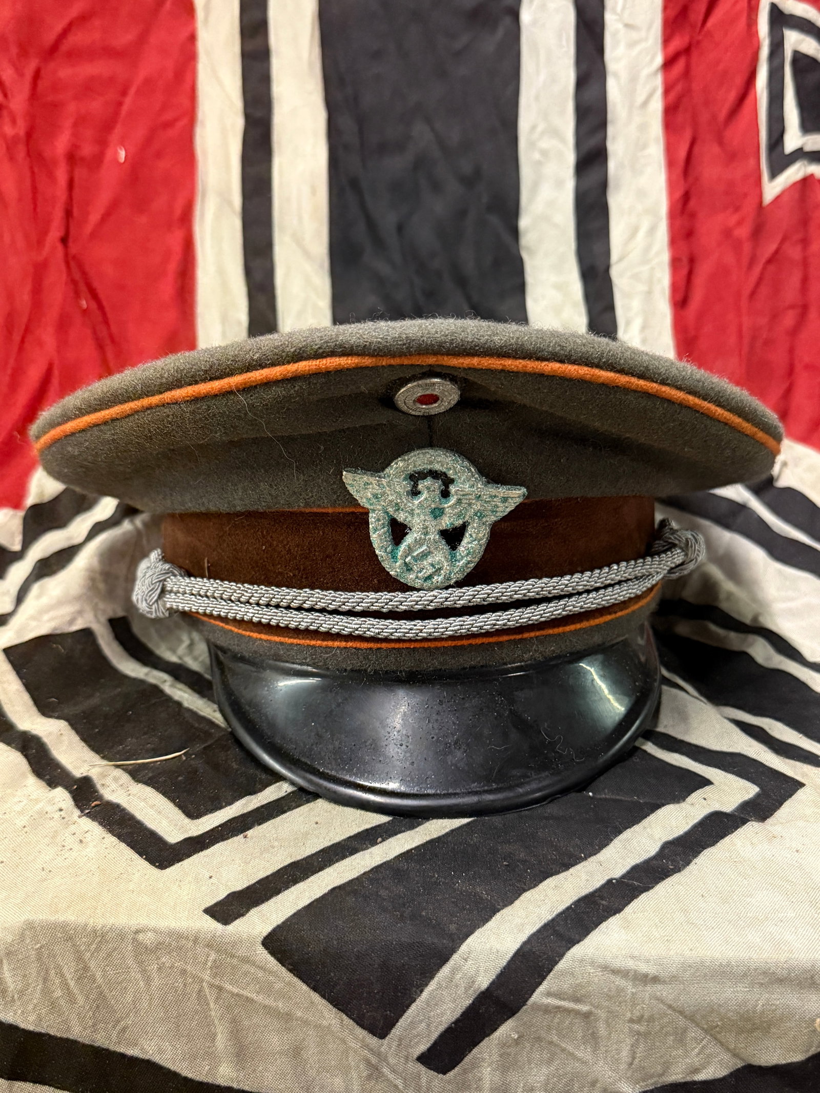 German WWII Police NCO Officer Visor Cap 1943 With RZM Paper Tag: German WWII Police NCO Officer Visor Cap 1943 With RZM Paper Tag. A scarce example that is in mint overall shape and condition with a beautiful overall patina. Has the RZM maker mark tag on the inside