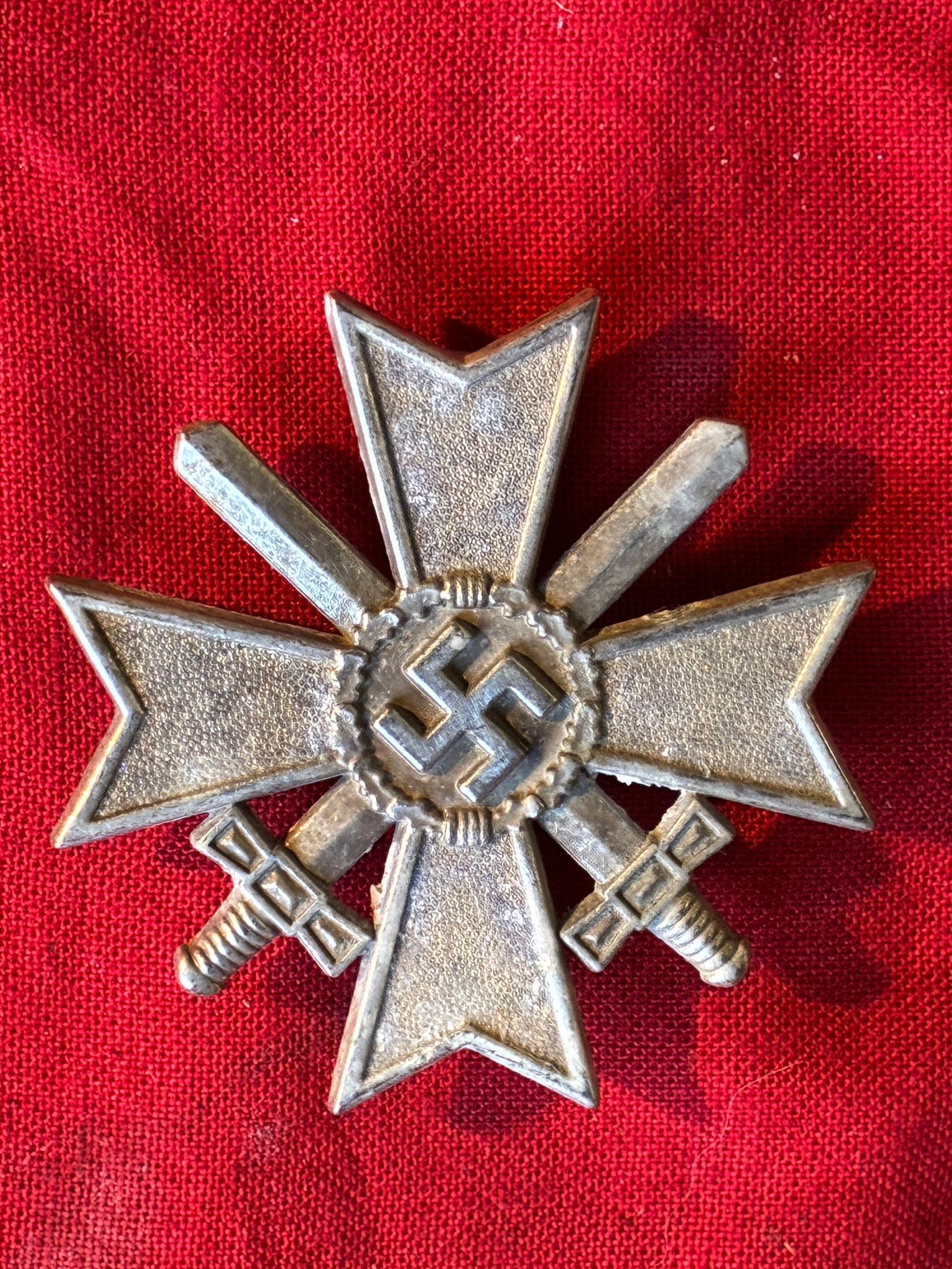 WW2 German War merit cross 1st class with swords: WW2 German War merit cross 1st class with swords. Early tombac cross with silver plated finish. High quality early war cross in lightly worn condition with some of the frosting worn down. Please view 