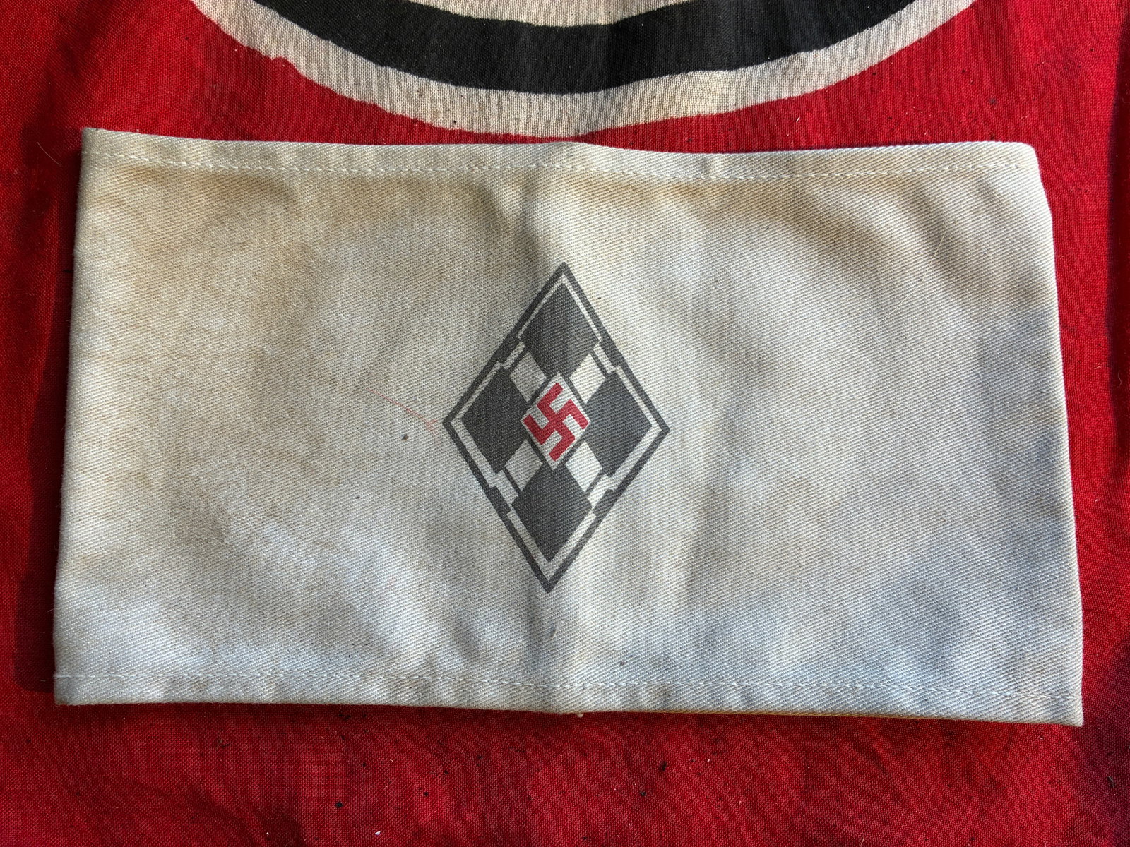 SCARCE WW2 GERMAN DIAMOND SHAPED HITLER YOUTH ARMBAND: SCARCE WW2 GERMAN DIAMOND SHAPED HITLER YOUTH ARMBAND. A RARE FIND. SHOWS GOOD WEAR AND USE WITH A BEAUTIFUL OVERALL PATINA. PLEASE VIEW ALL DETAILED PICTURES. A SCARCE FIND FOR THE ANTIQUE MILITARY C