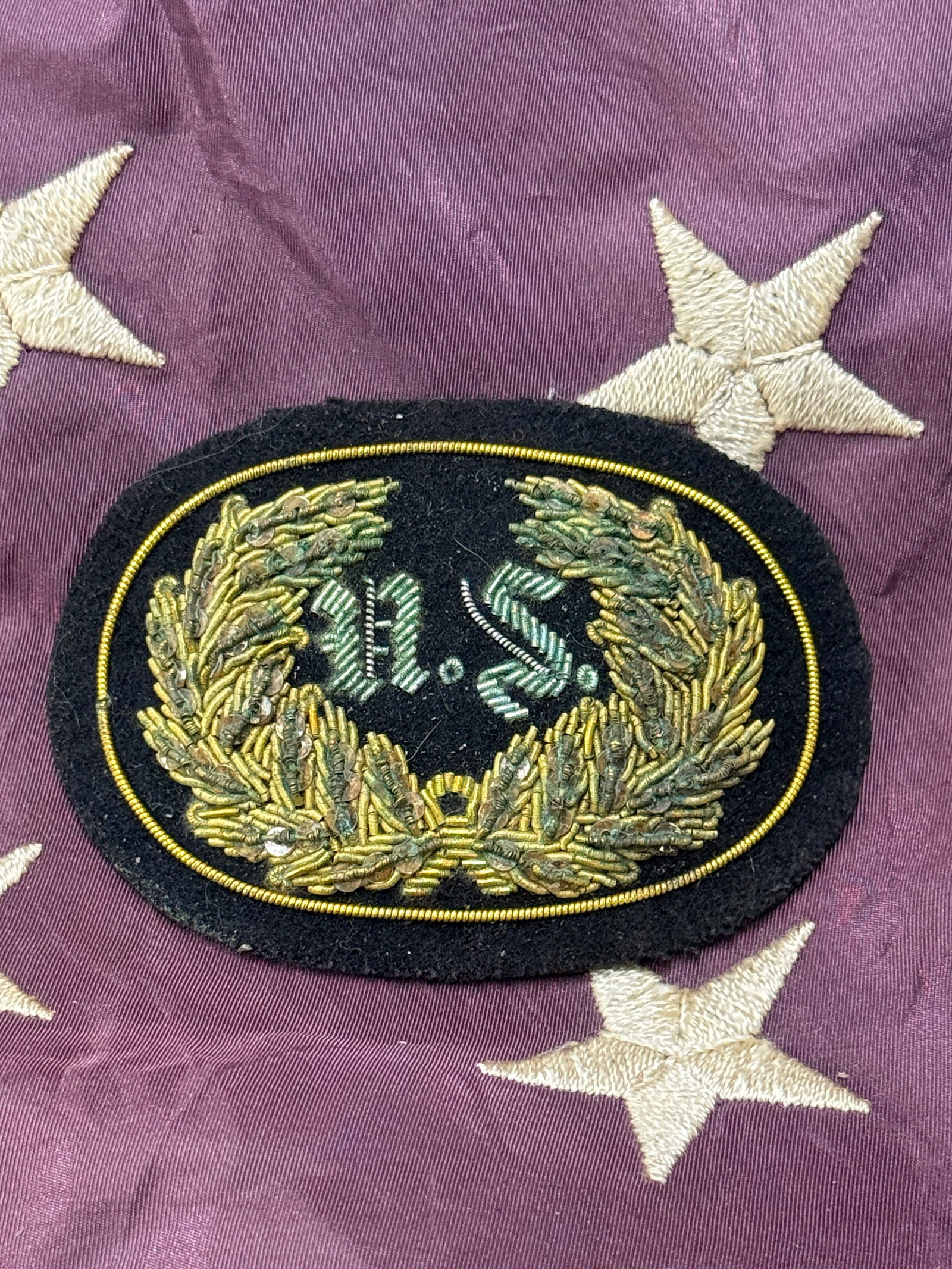 CIVIL WAR UNION U.S. WITH WREATH BULLION HEADGEAR BADGE BY JOHN A. BAKER: CIVIL WAR UNION U.S. WITH WREATH BULLION HEADGEAR BADGE BY JOHN A. BAKER. A VERY RARE EXAMPLE. SHOWS GOOD WEAR AND USE WITH A BEAUTIFUL OVERALL PATINA. PLEASE VIEW ALL DETAILED PICTURES. A RARE EXAMPL