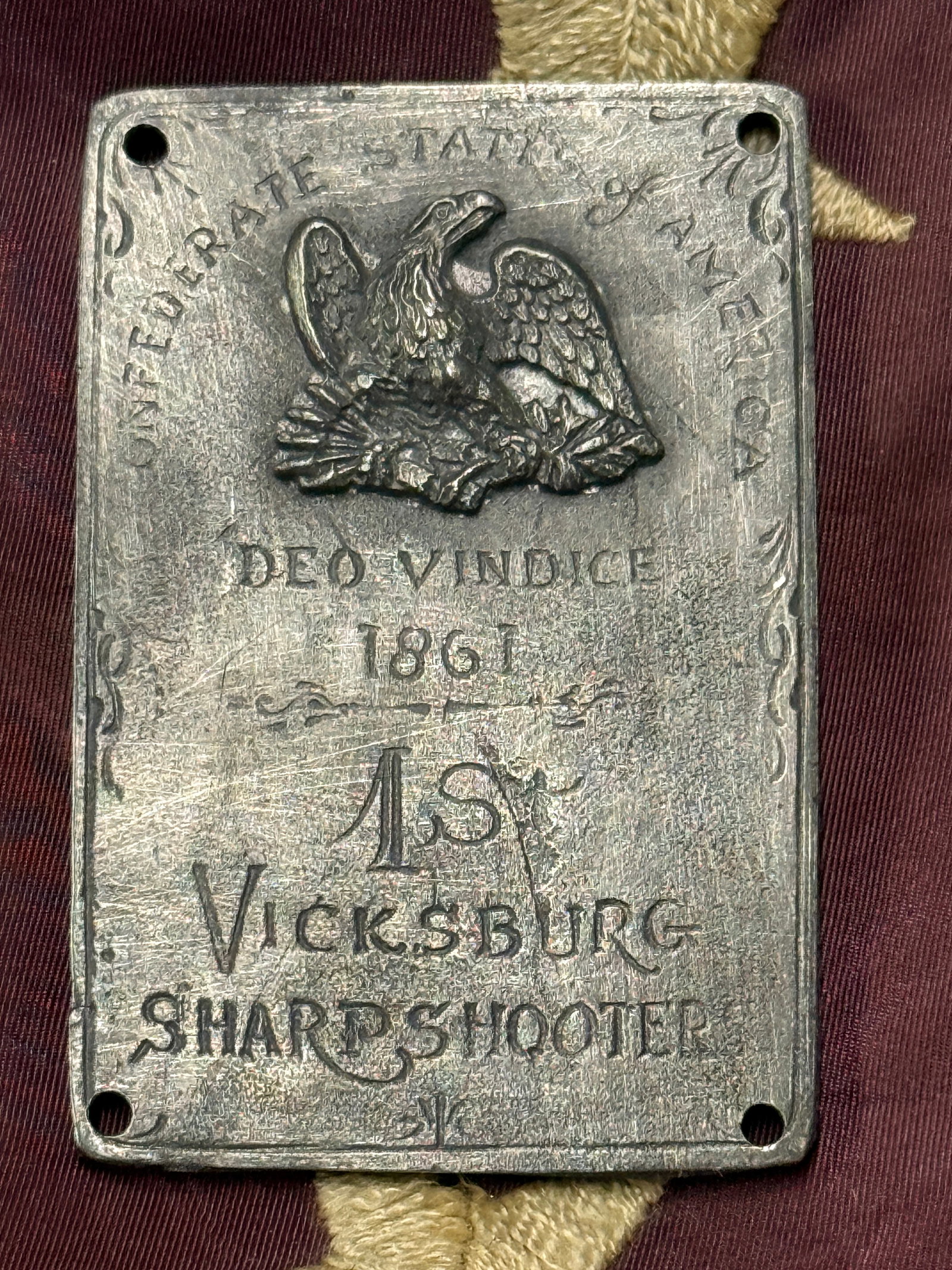 CIVIL WAR CONFEDERATE CSA DEO VINDICE 1861 1ST VICKSBURG SHARPSHOOTER PLATE: CIVIL WAR CONFEDERATE CSA DEO VINDICE 1861 1ST VICKSBURG SHARPSHOOTER PLATE. A VERY RARE FIND. SHOWS GOOD WEAR AND USE WITH A BEAUTIFUL OVERALL PATINA. VERY WELL USED AND SHOWS FADING ON SOME PARTS. A