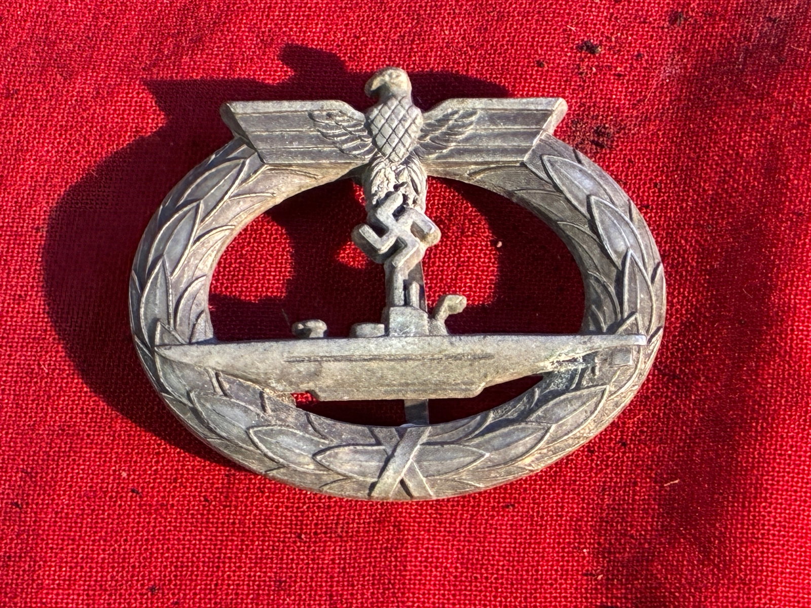 German WWII Kriegsmarine Metal U-Boat War Badge by Schwerin Berlin 68: German WWII Kriegsmarine Metal U-Boat War Badge by Schwerin Berlin 68. The U-boat War Badge (U-Boot-Kriegsabzeichen) was a German war badge that was awarded to U-boat crew members during World War I a
