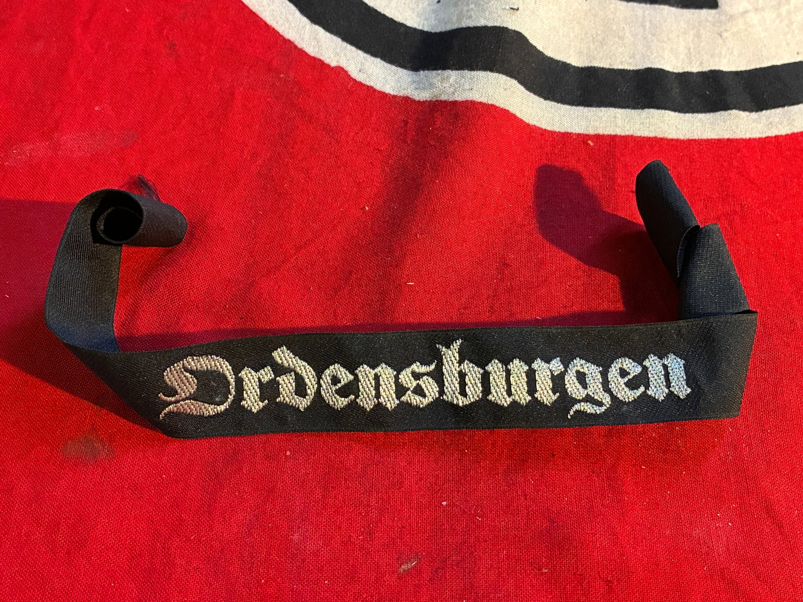 WW2 Flat Wire ORDENSBURGEN Political Leader School Cuff Title Woven: WW2 Flat Wire ORDENSBURGEN Political Leader School Cuff Title Woven. A rare example. Shows good wear and use with a beautiful overall patina. Please view all detailed pictures. A rare example of the t
