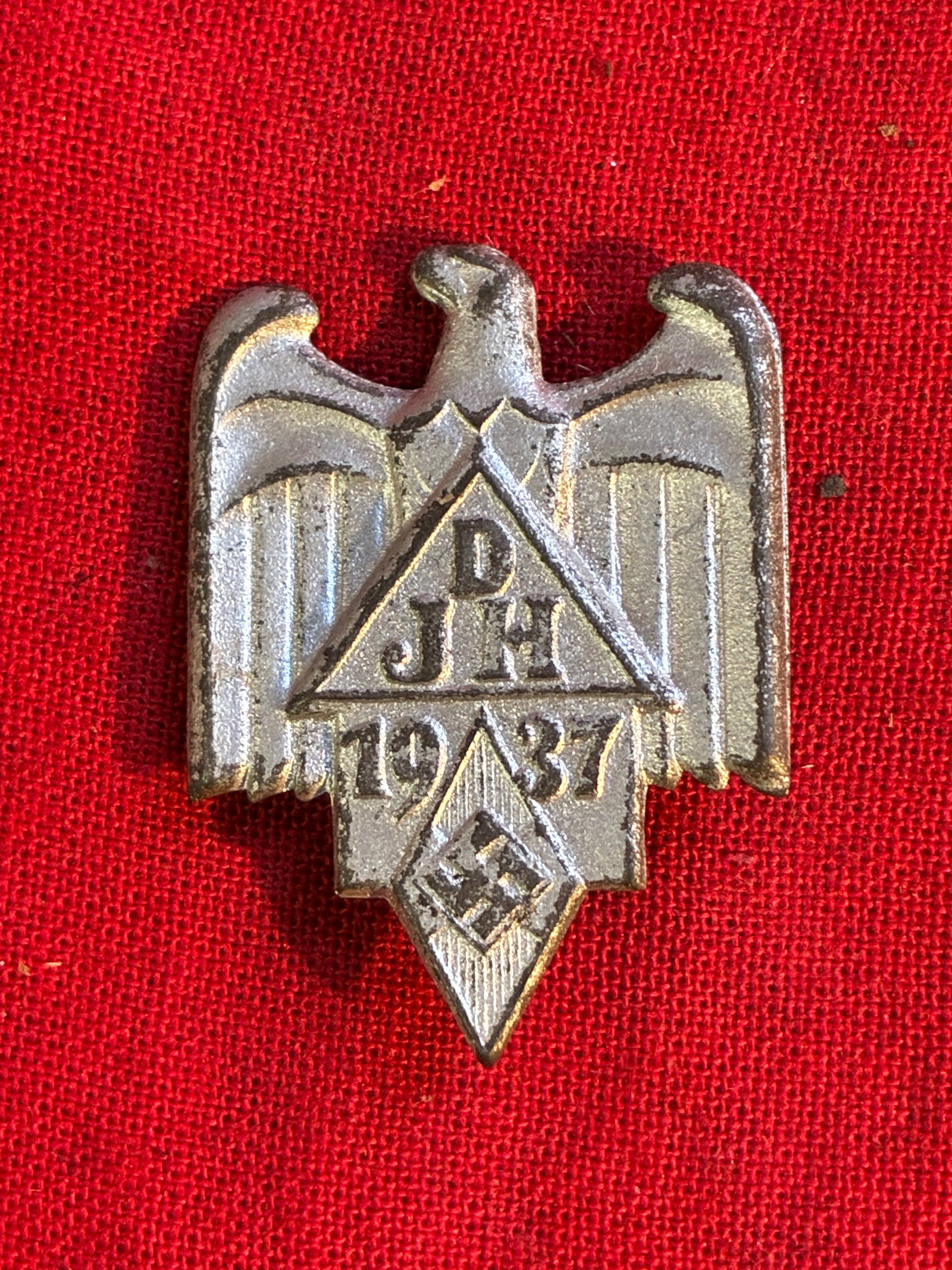 RARE WW2 GERMAN NAZI HITLER YOUTH DJH 1937 TINNIE BADGE: RARE WW2 GERMAN NAZI HITLER YOUTH DJH 1937 TINNIE BADGE. SHOWS GOOD WEAR AND USE WITH A BEAUTIFUL OVERALL PATINA. PLEASE VIEW ALL DETAILED PICTURES. A RARE EXAMPLE.