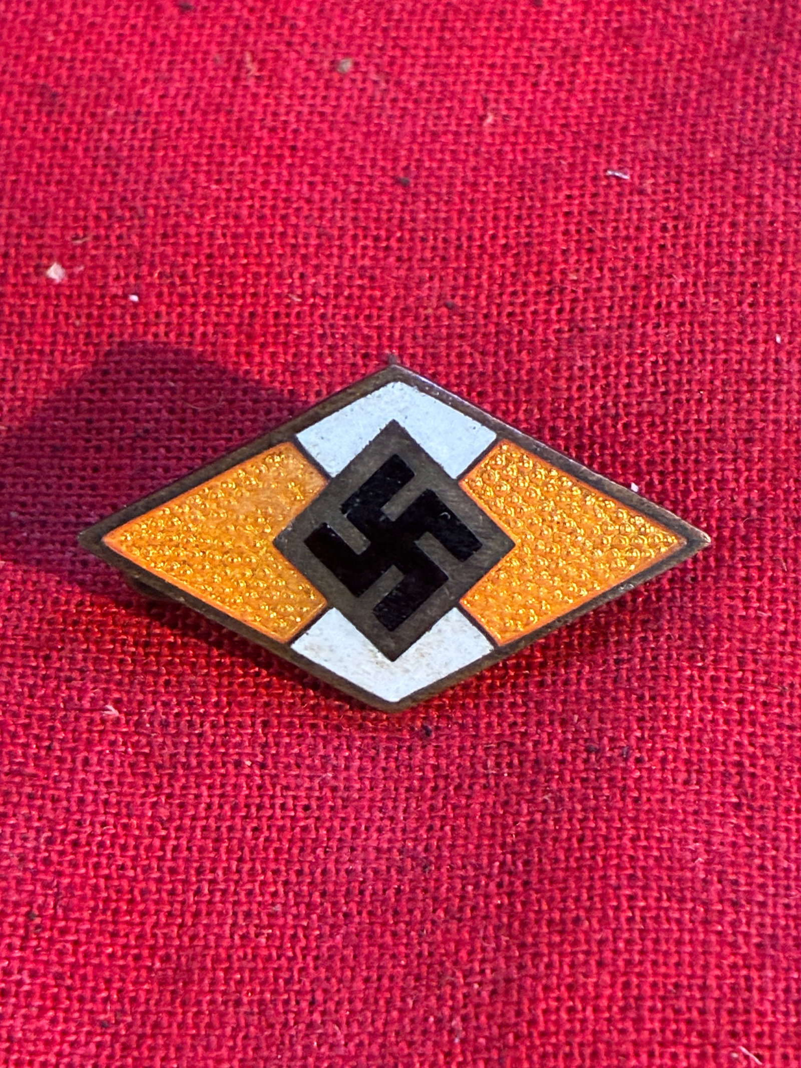 WWII German Hitler Youth (Hitler Jugend) Membership Badge Yellow By Ges. Gesch.: WWII German Hitler Youth (Hitler Jugend) Membership Badge Yellow By Ges. Gesch. A scarce find. Shows good wear and use with a beautiful overall patina. Please view all detailed pictures. A rare exampl