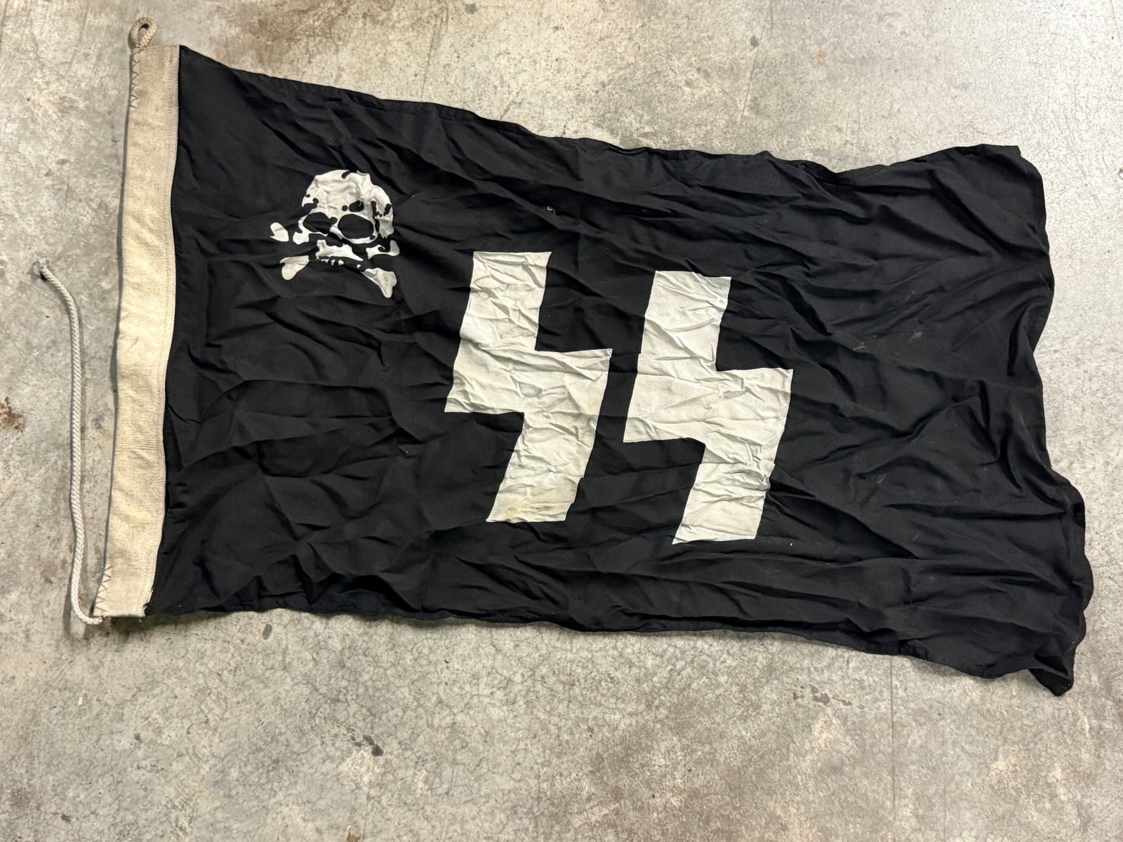 Rare WWII German Totenkopf Waffen SS Totenkopf SS Runes & Skull flag, Cotton 3? x 5?: Rare WWII German Totenkopf Waffen SS Totenkopf SS Runes & Skull flag, Cotton 3? x 5?. An ultra rare find. The Waffen-SS was the military branch of the Nazi Party’s SS organization. Its formations in