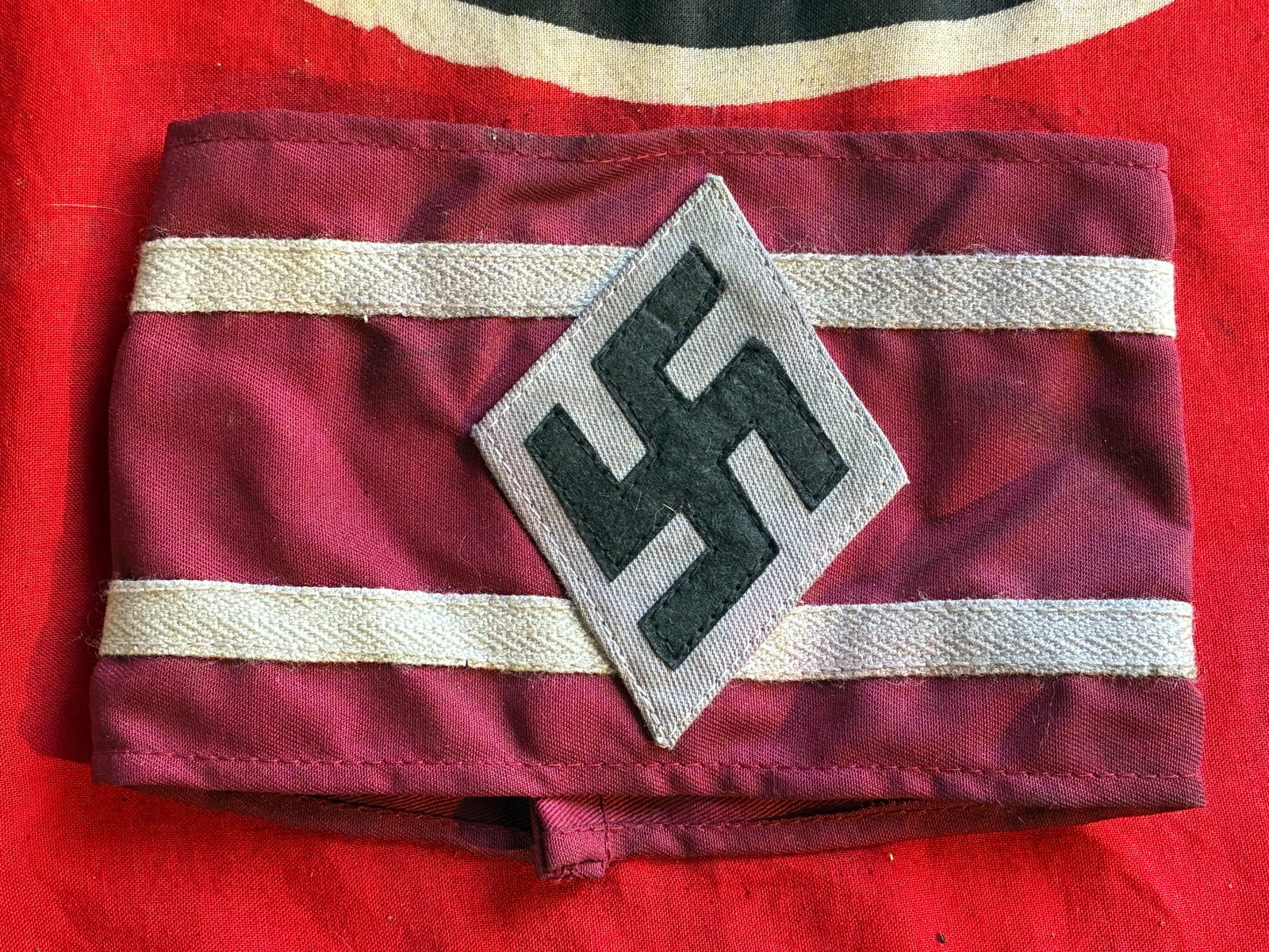 WW2 GERMAN HITLER YOUTH STUDENTS ARMBAND WITH RZM PAPER TAG: WW2 GERMAN HITLER YOUTH STUDENTS ARMBAND WITH RZM PAPER TAG. A VERY RARE FIND. SHOWS GOOD WEAR AND USE WITH A BEAUTIFUL OVERALL PATINA. COMES FROM A LARGE COLLECTION. PLEASE VIEW ALL DETAILED PICTURES