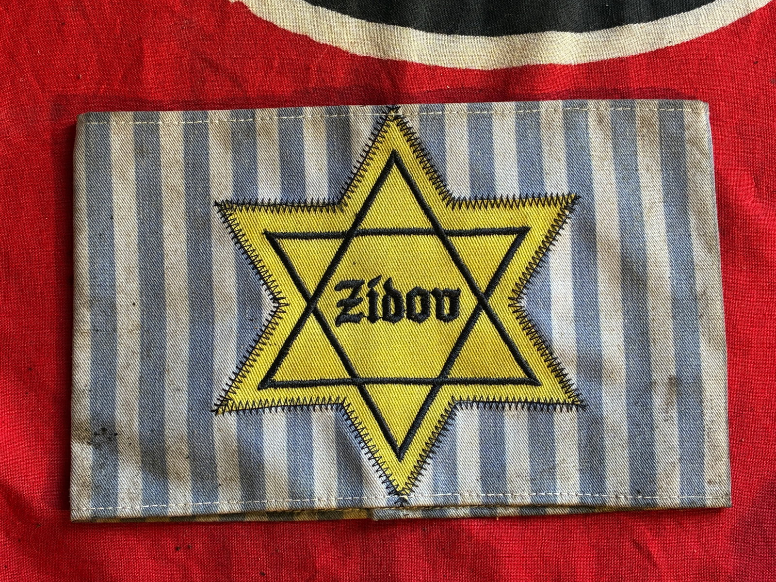WW2 GERMAN YUGOSLAVIAN ZIDOV CONCENTRATION CAMP STAR ARMBAND: WW2 GERMAN YUGOSLAVIAN ZIDOV CONCENTRATION CAMP STAR ARMBAND. A VERY RARE FIND. SHOWS GOOD WEAR AND USE WITH A BEAUTIFUL OVERALL PATINA. PLEASE VIEW ALL DETAILED PICTURES. A RARE EXAMPLE OF THE TIME P