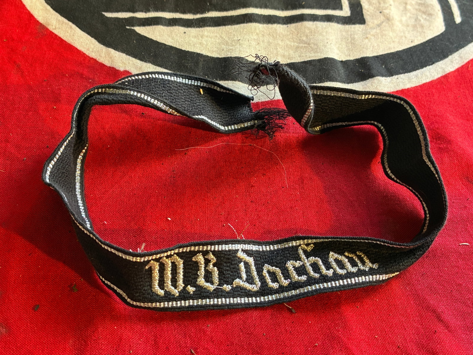 SCARCE WW2 GERMAN DACHAU CUFF TITLE: SCARCE WW2 GERMAN DACHAU CUFF TITLE. A VERY RARE FIELD WORN CONDITION. SHOWS GOOD WEAR AND USE WITH A BEAUTIFUL OVERALL PATINA. PLEASE VIEW ALL DETAILED PICTURES. A RARE EXAMPLE OF THE TIME PERIOD.