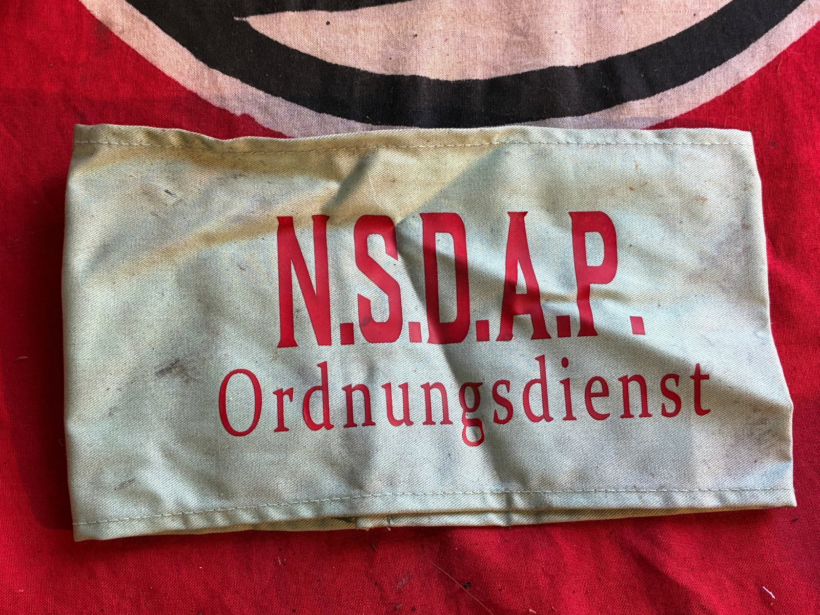 WW2 GERMAN NSDAP ORDNUNGSDIENST SECURITY ARMBAND: WW2 GERMAN NSDAP ORDNUNGSDIENST SECURITY ARMBAND. A VERY RARE EXAMPLE THAT IS IN MINT OVERALL SHAPE AND CONDITION WITH A BEAUTIFUL OVERALL PATINA. PLEASE VIEW ALL DETAILED PICTURES. A SCARCE EXAMPLE O