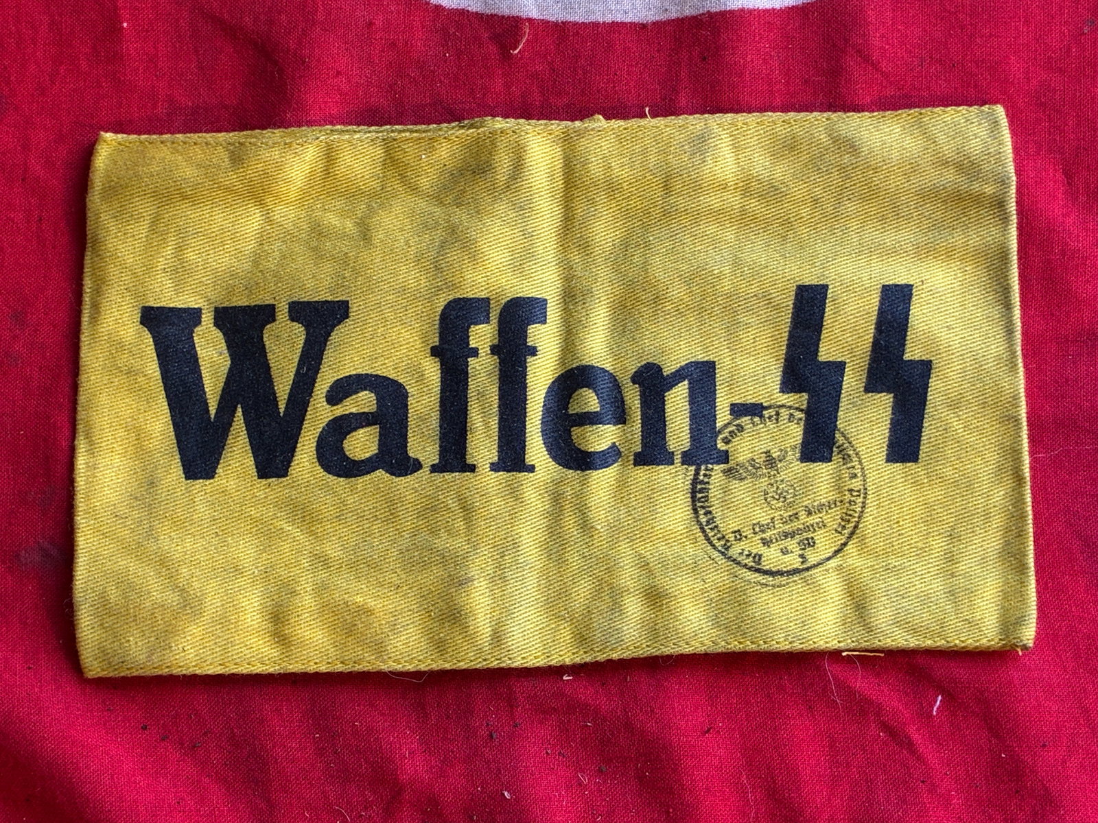 WW2 GERMAN WAFFEN SS AMRMBAND WITH INSPECTION STAMP AND RZM PAPER TAG: WW2 GERMAN WAFFEN SS AMRMBAND WITH INSPECTION STAMP AND RZM PAPER TAG. A VERY RARE FIND. SHOWS GOOD WEAR AND USE WITH A BEAUTIFUL OVERALL PATINA. SHOWS GOOD WEAR AND USE. PLEASE VIEW ALL DETAILED PICT