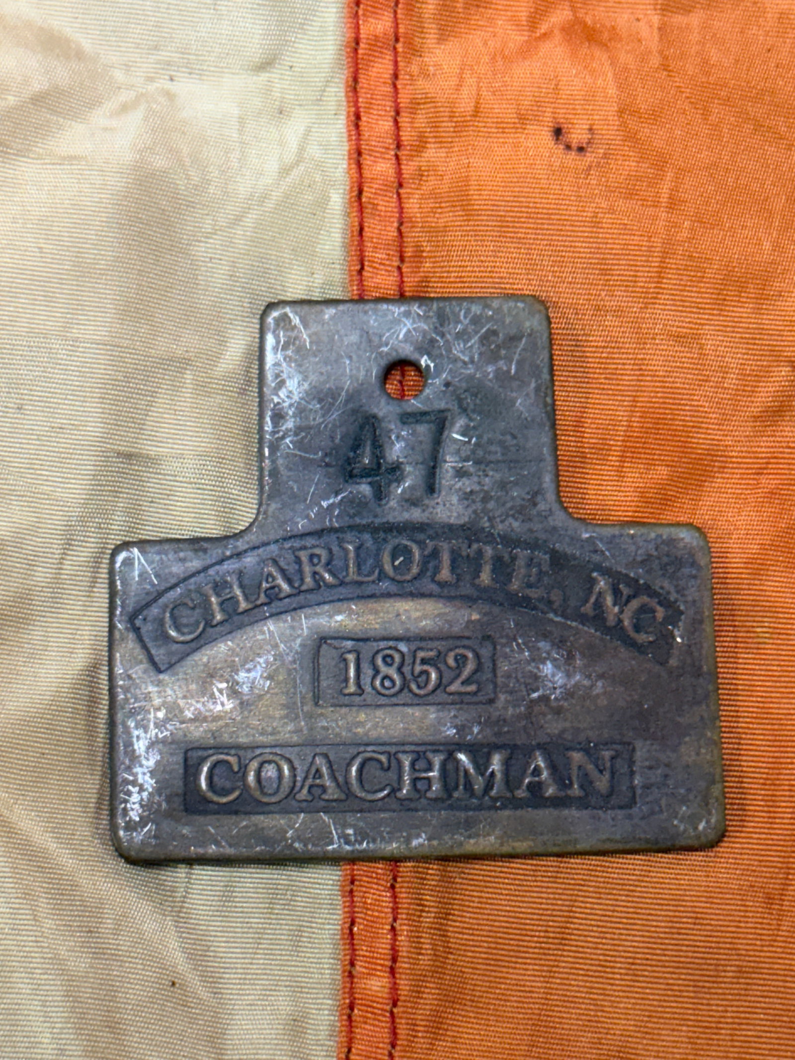 DATED 1852 #47 CHARLOTTE, NC COACHMAN SLAVE TAG SERVANT ID: DATED 1852 #47 CHARLOTTE, NC COACHMAN SLAVE TAG SERVANT ID. A VERY RARE EXAMPLE THAT IS IN MINT OVERALL SHAPE AND CONDITION WITH A BEAUTIFUL OVERALL PATINA. HAS A GREAT LOOK TO IT WITH AN EXCELLENT OV