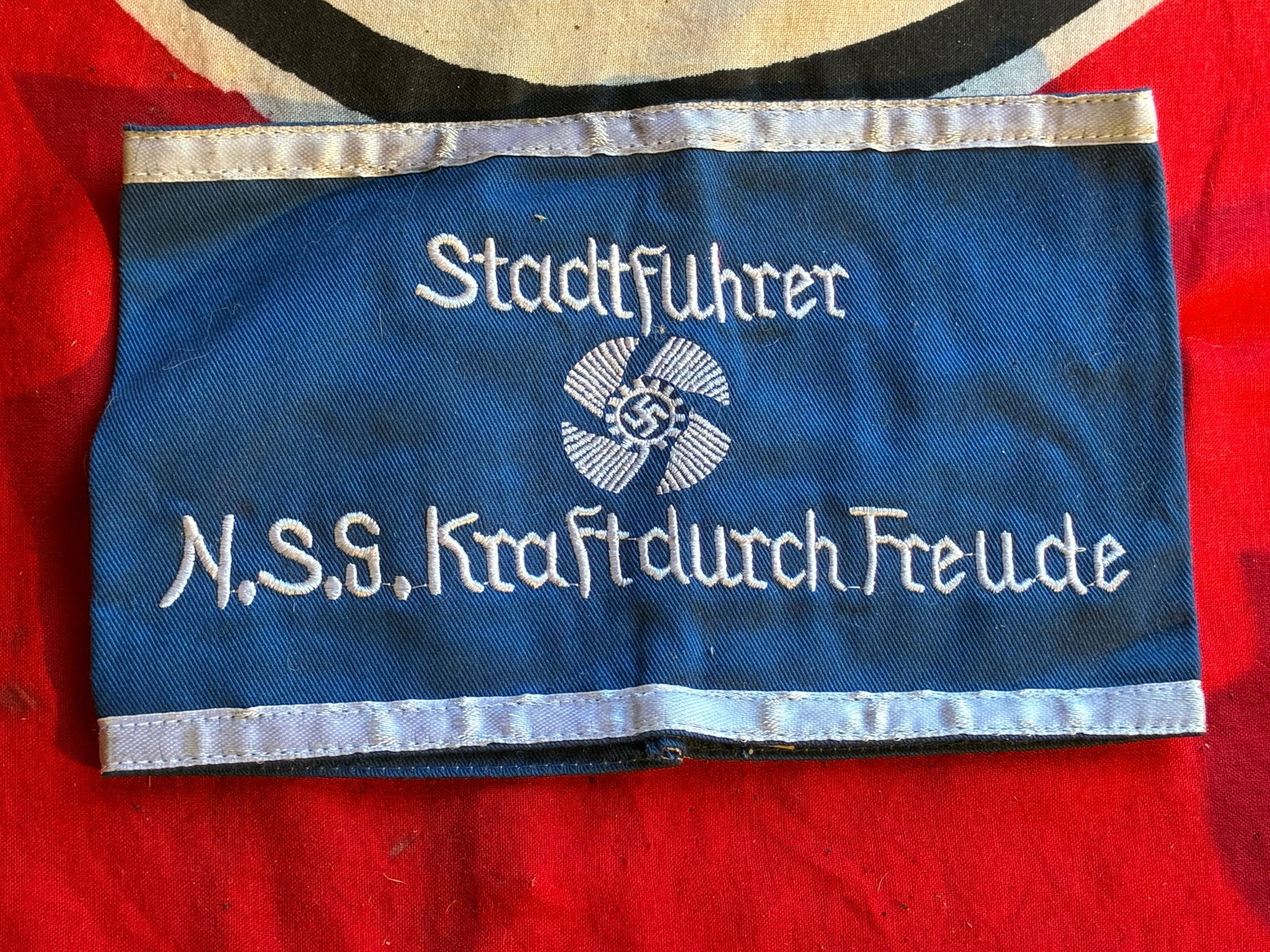 WW2 GERMAN ARMBAND OF THE NS KRAFTDURCH FREUDE "DAF WORKERS FRONT" WITH RZM PAPER TAG: WW2 GERMAN ARMBAND OF THE NS KRAFTDURCH FREUDE "DAF WORKERS FRONT" WITH RZM PAPER TAG. A RARE EXAMPLE. SHOWS GOOD WEAR AND USE WITH A BEAUTIFUL OVERALL PATINA. PLEASE VIEW ALL DETAILED PICTURES. A RAR
