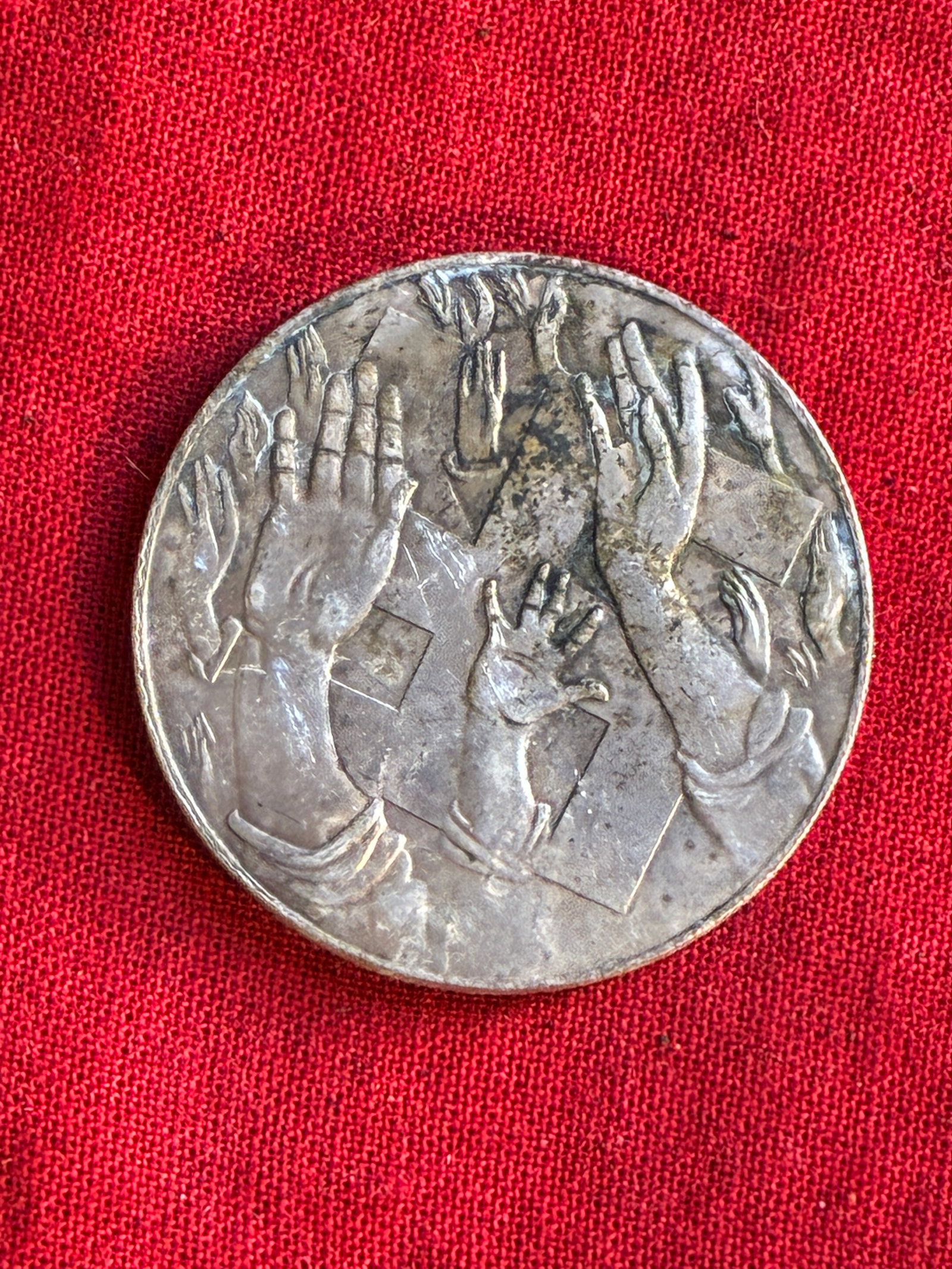 WW2 German 1932 Election Token in Silver: WW2 German 1932 Election Token in Silver. Commemorates the act of voting itself in the 1932 Reichstag election. The obverse features a swastika buried in a sea of raised hands perhaps indicating it wa