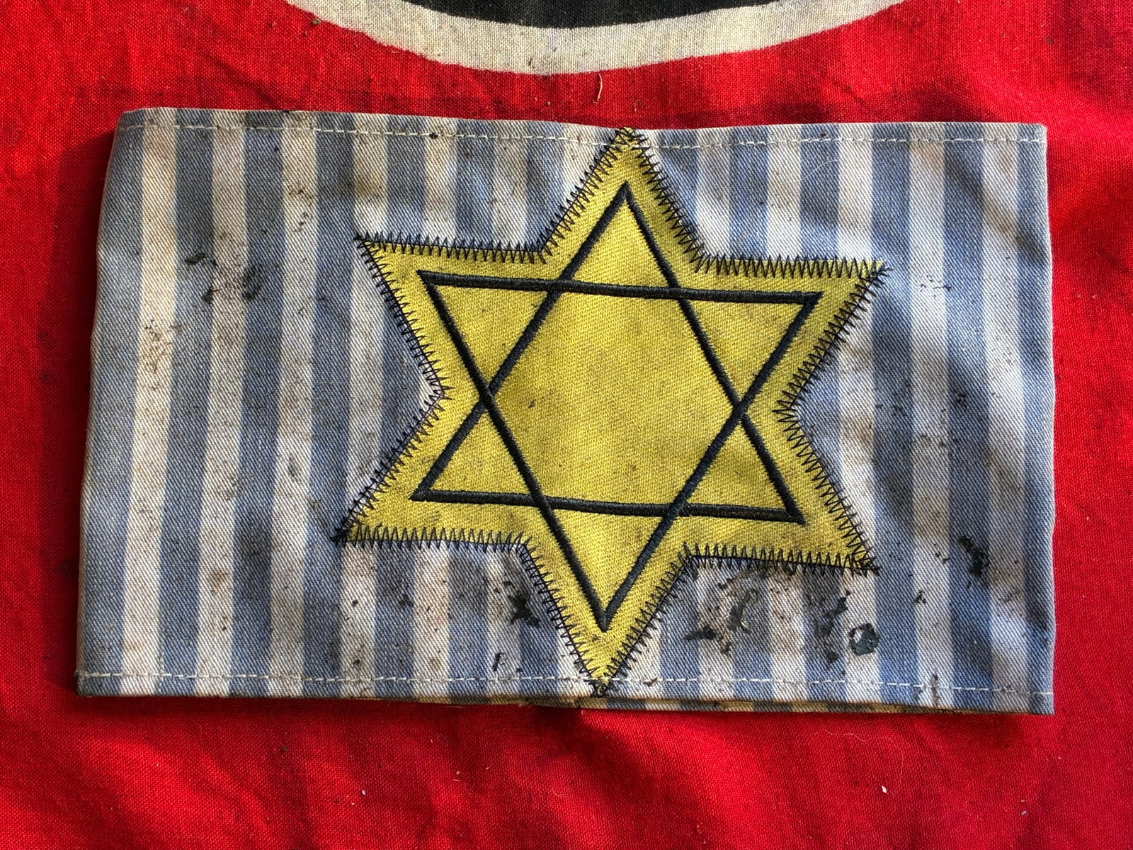 RARE WW2 GERMAN CONCENTRATION CAMP UNIFORM ARMBAND WITH STAR OF DAVID: RARE WW2 GERMAN CONCENTRATION CAMP UNIFORM ARMBAND WITH STAR OF DAVID. A RARE FIND. SHOWS GOOD WEAR AND USE WITH A BEAUTIFUL OVERALL PATINA. SHOWS GOOD WEAR AND USE. PLEASE VIEW ALL DETAILED PICTURES.