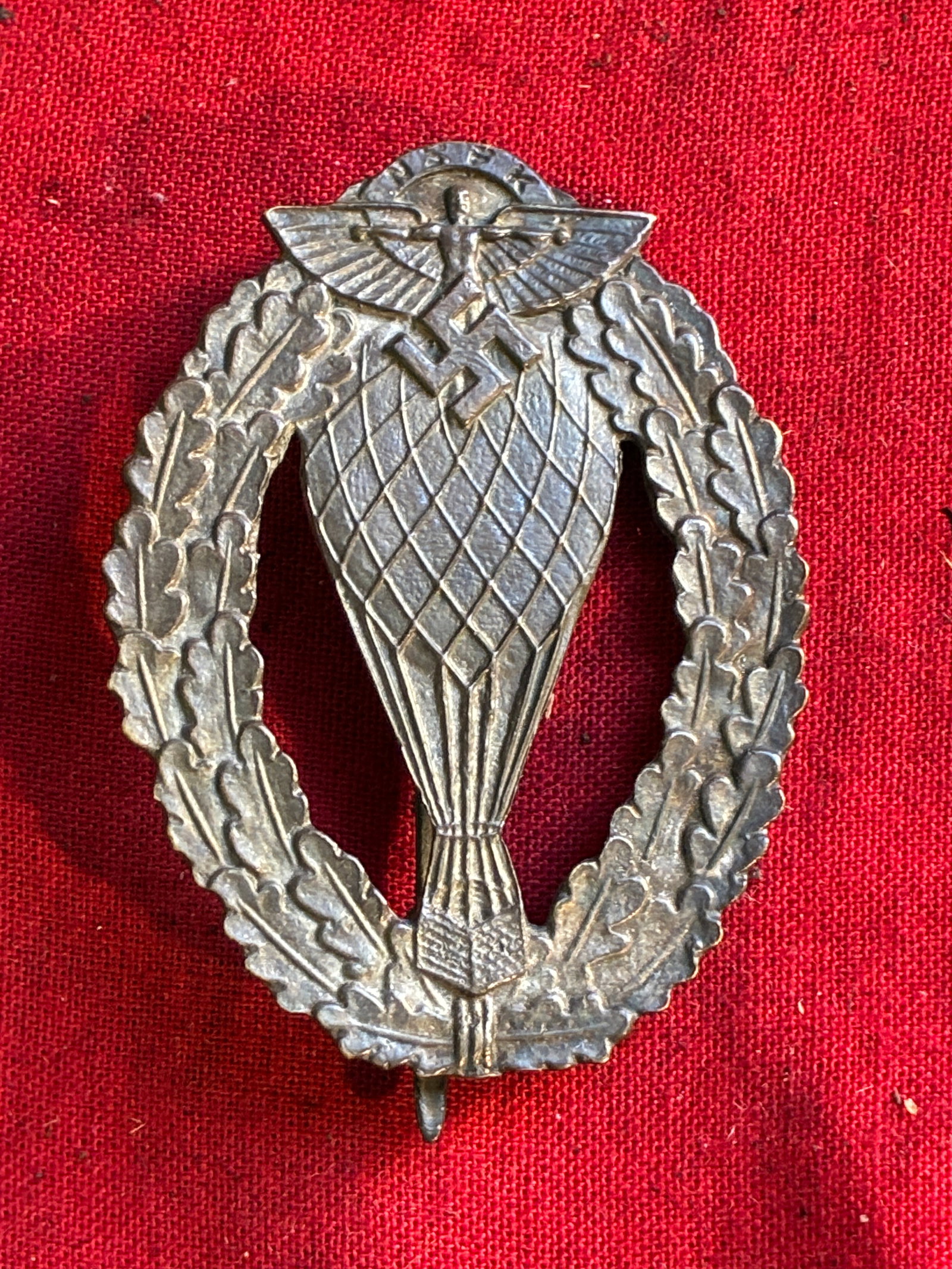 WWII GERMAN THIRD REICH NSFK BALLOON PILOT BADGE: WWII German NSFK balloon pilot badge. Measures 1.75 X 2.25 inches. Features a 180 degree pin lie. Very good condition.
