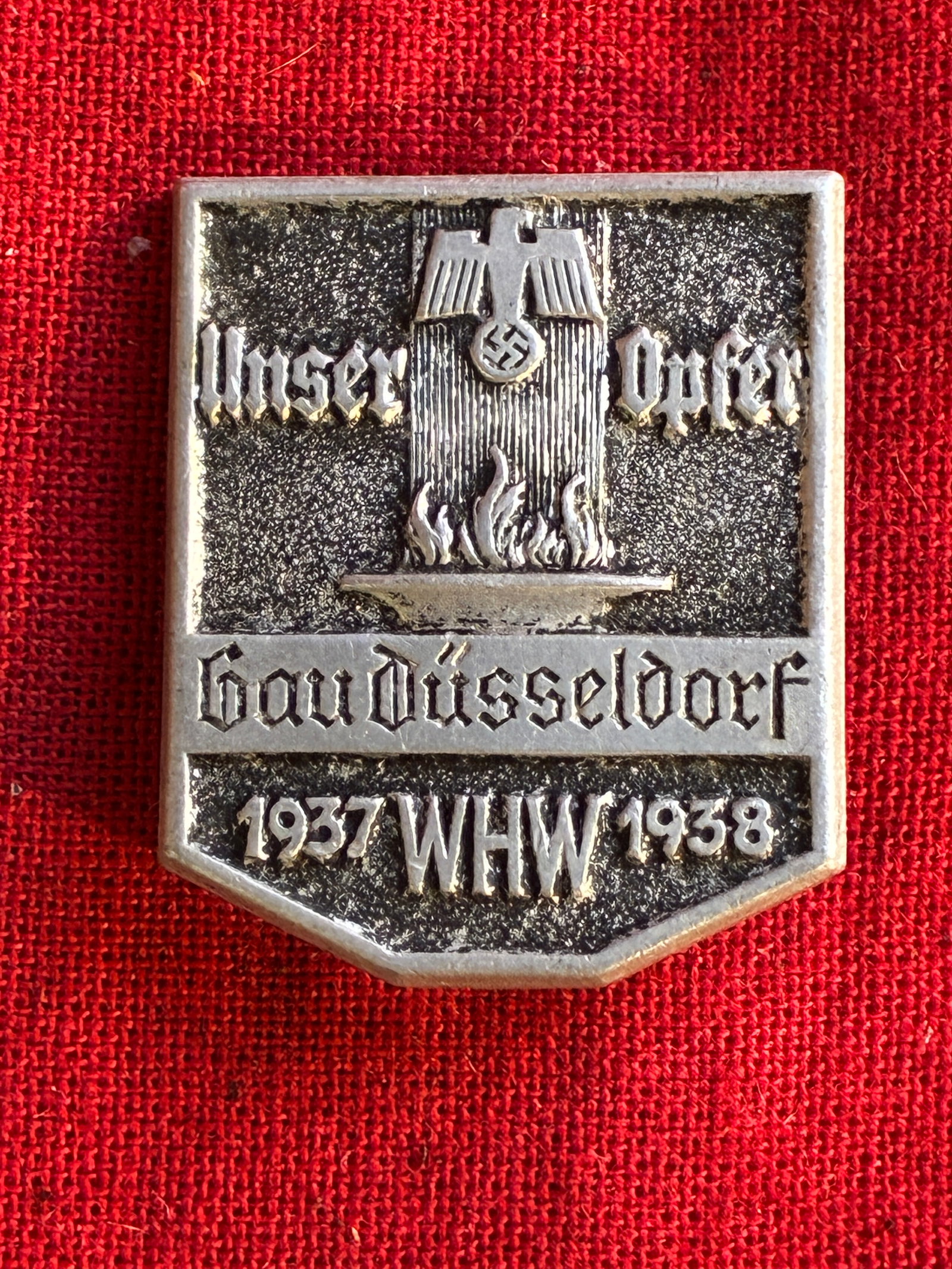 German WW2 Tinnie Badge 1937 WHW 1938 Unser Opfer Gau Dusseldorf: German WW2 Tinnie Badge 1937 WHW 1938 Unser Opfer Gau Dusseldorf