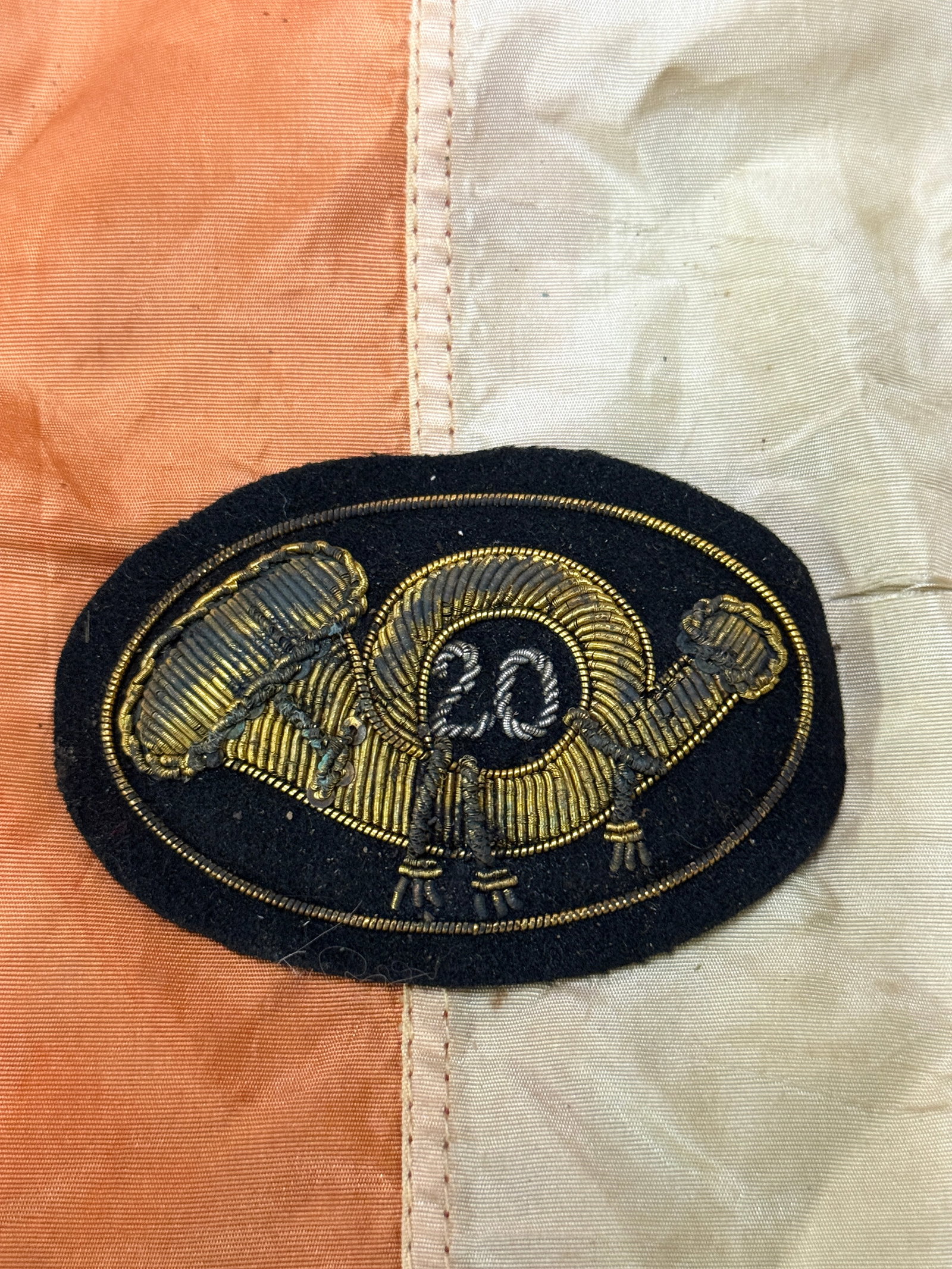 CIVIL WAR 20TH INFANTRY BULLION CLOTH BADGE BY SCHUYLER HARTLEY GRAHAM: CIVIL WAR 20TH INFANTRY BULLION CLOTH BADGE BY SCHUYLER HARTLEY GRAHAM. A VERY RARE FIND. SHOWS GOOD WEAR AND USE WITH A BEAUTIFUL OVERALL PATINA. HAS A GREAT LOOK TO IT WITH AN EXCELLENT OVERALL EYE 