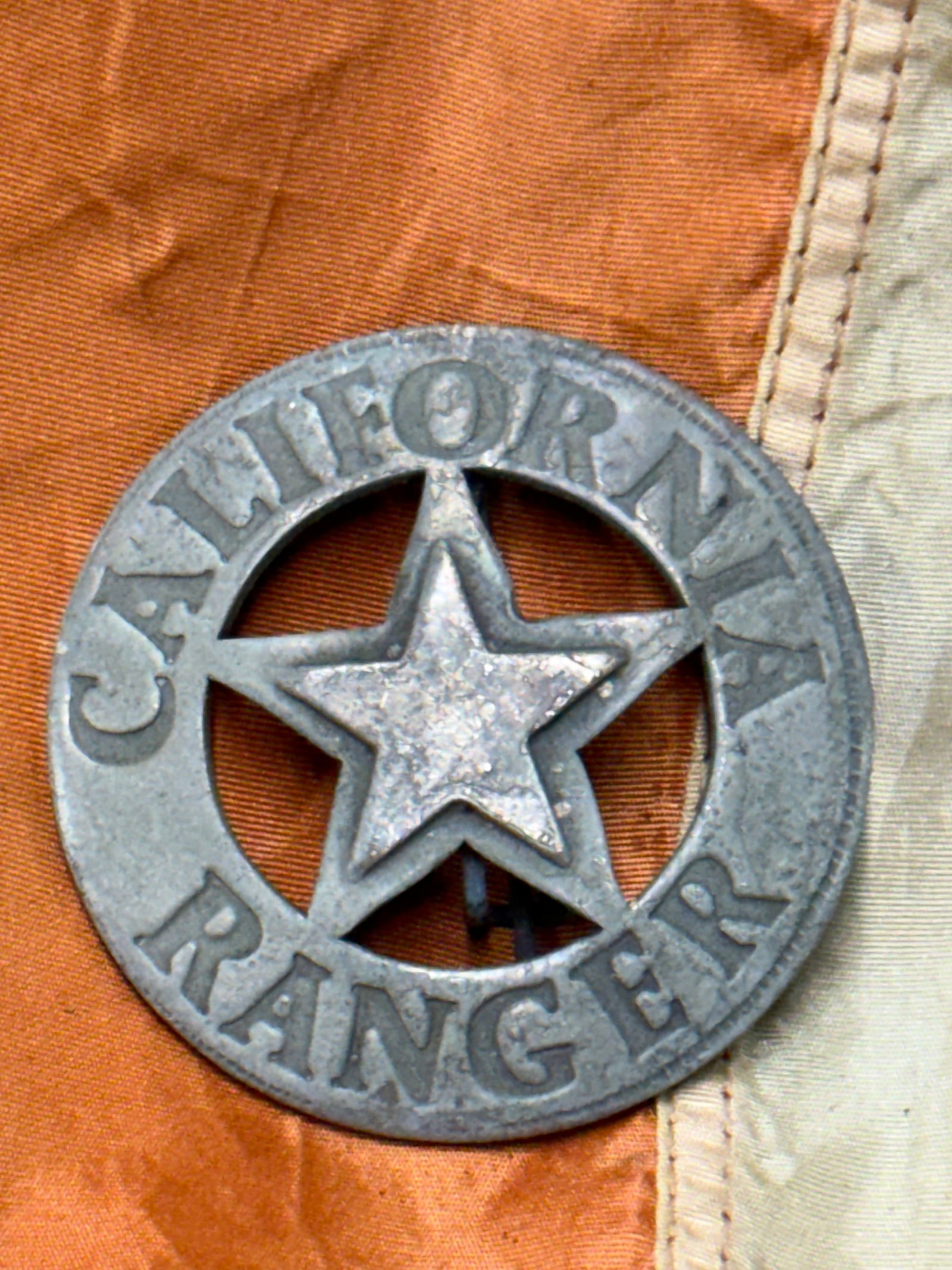 ANTIQUE 1800'S CALIFORNIA RANGER BADGE: ANTIQUE 1800'S CALIFORNIA RANGER BADGE. A VERY RARE FIND. MAKER MARKED ON THE BLADE. HAS BEAUTIFUL EBONY WOOD HANDLES THAT ARE TACKED. THE BLADE IS MAKER MARKED. COMES WITH THE ORIGINAL LEATHER SCABBA