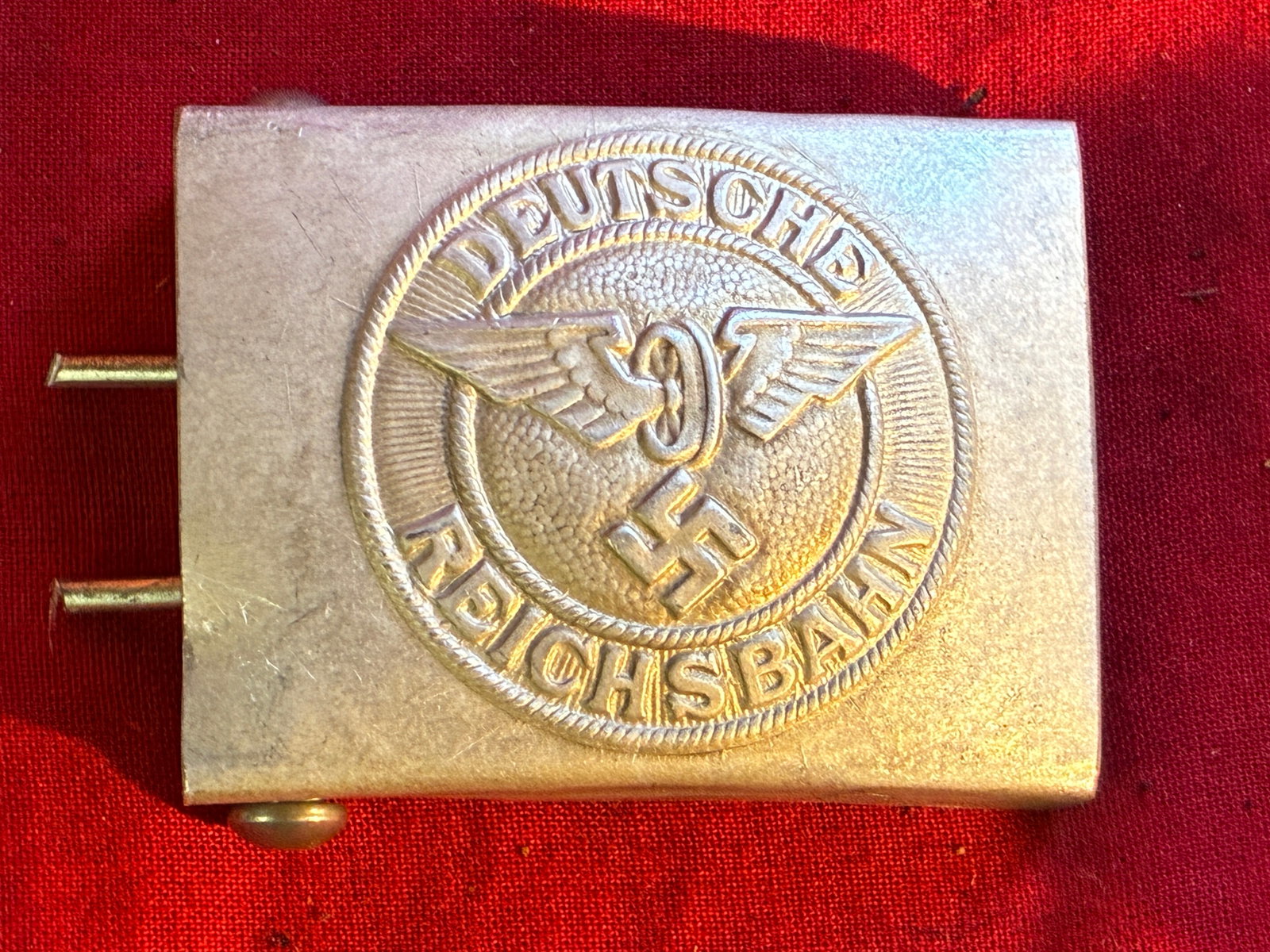 WWII GERMAN DEUTSCHE REICHSBAHN BELT BUCKLE BY RZM M34/2: WWII GERMAN DEUTSCHE REICHSBAHN BELT BUCKLE BY RZM M34/2. WWII German Deutsche Reichsbahn belt buckle. Maker's marked "RZM M34/2" on the back. Measures 2 X 2.5 inches. Very good condition. Please view