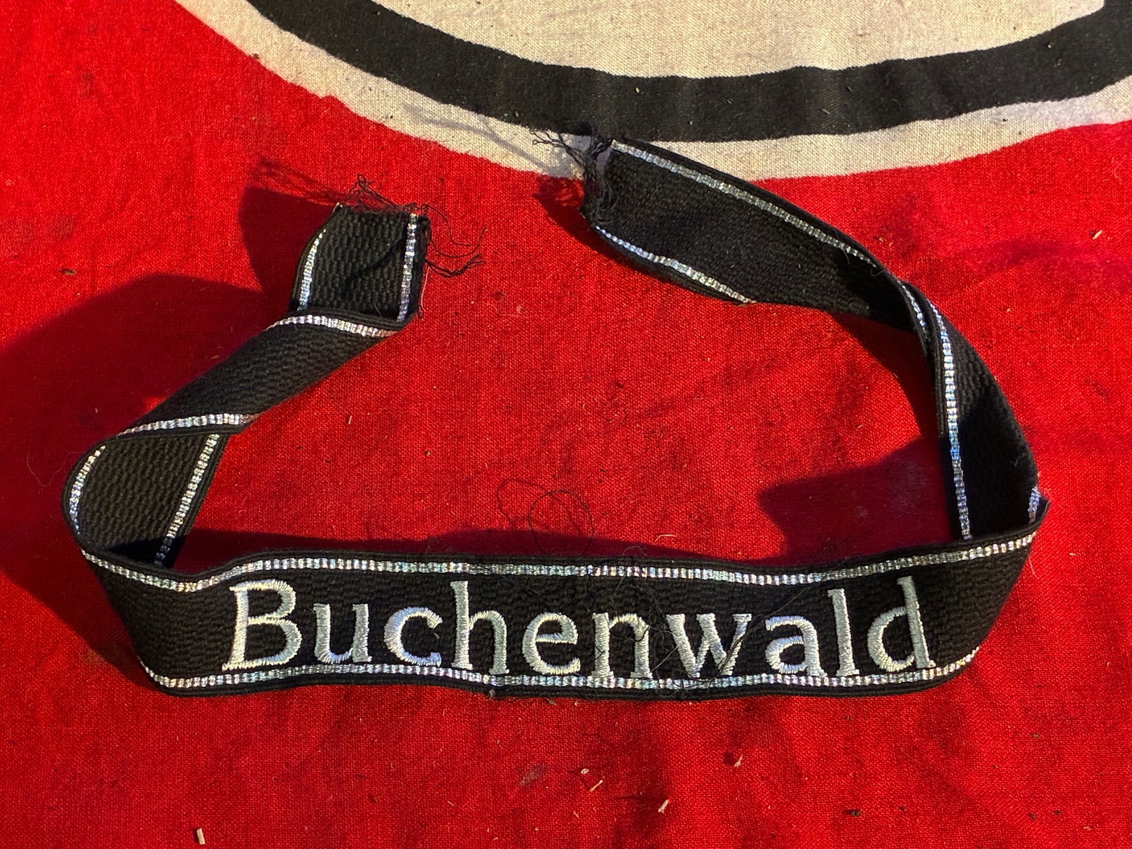 WW2 German Waffen SS Buchenwald Concentration Camp Cuff Title: WW2 German Waffen SS Buchenwald Concentration Camp Cuff Title. mbroidered with correct 7 strand bullion band strips. Shows good wear and use with a beautiful overall patina. Please view all detailed p