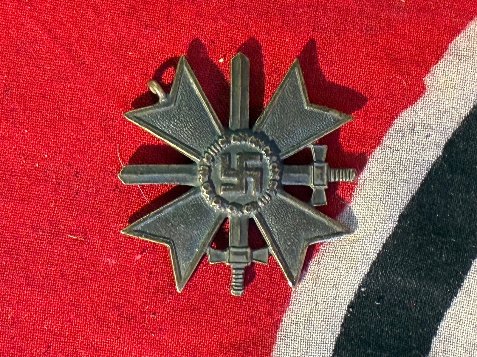 RARE WW2 GERMAN MERIT CROSS WITH SWORDS IN SILVER MEDAL: RARE WW2 GERMAN MERIT CROSS WITH SWORDS IN SILVER MEDAL. A RARE FIND. SHOWS GOOD WEAR AND USE WITH A BEAUTIFUL OVERALL PATINA. PLEASE VIEW ALL DETAILED PICTURES. A RARE EXAMPLE.
