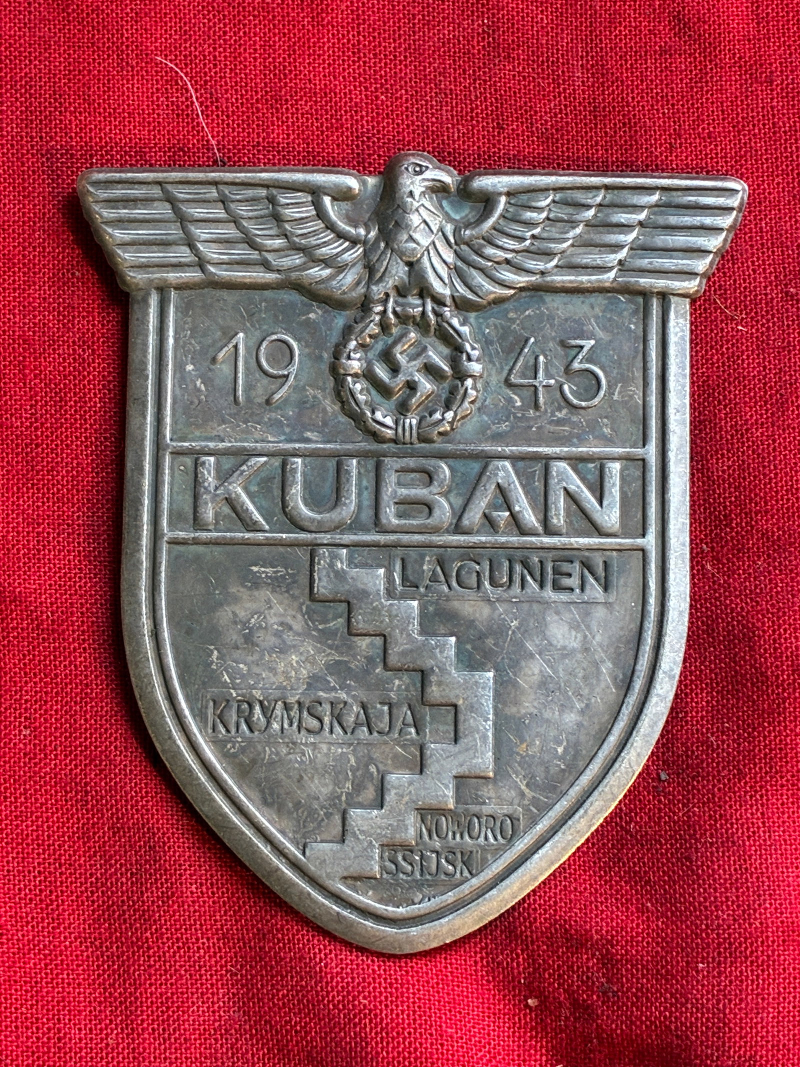 WW2 Germany KUBAN Service Shield Badge Pin: WW2 Germany KUBAN Service Shield Badge Pin. Comes with the pin backs attached. Please view all detailed pictures. A rare example of the time period.
